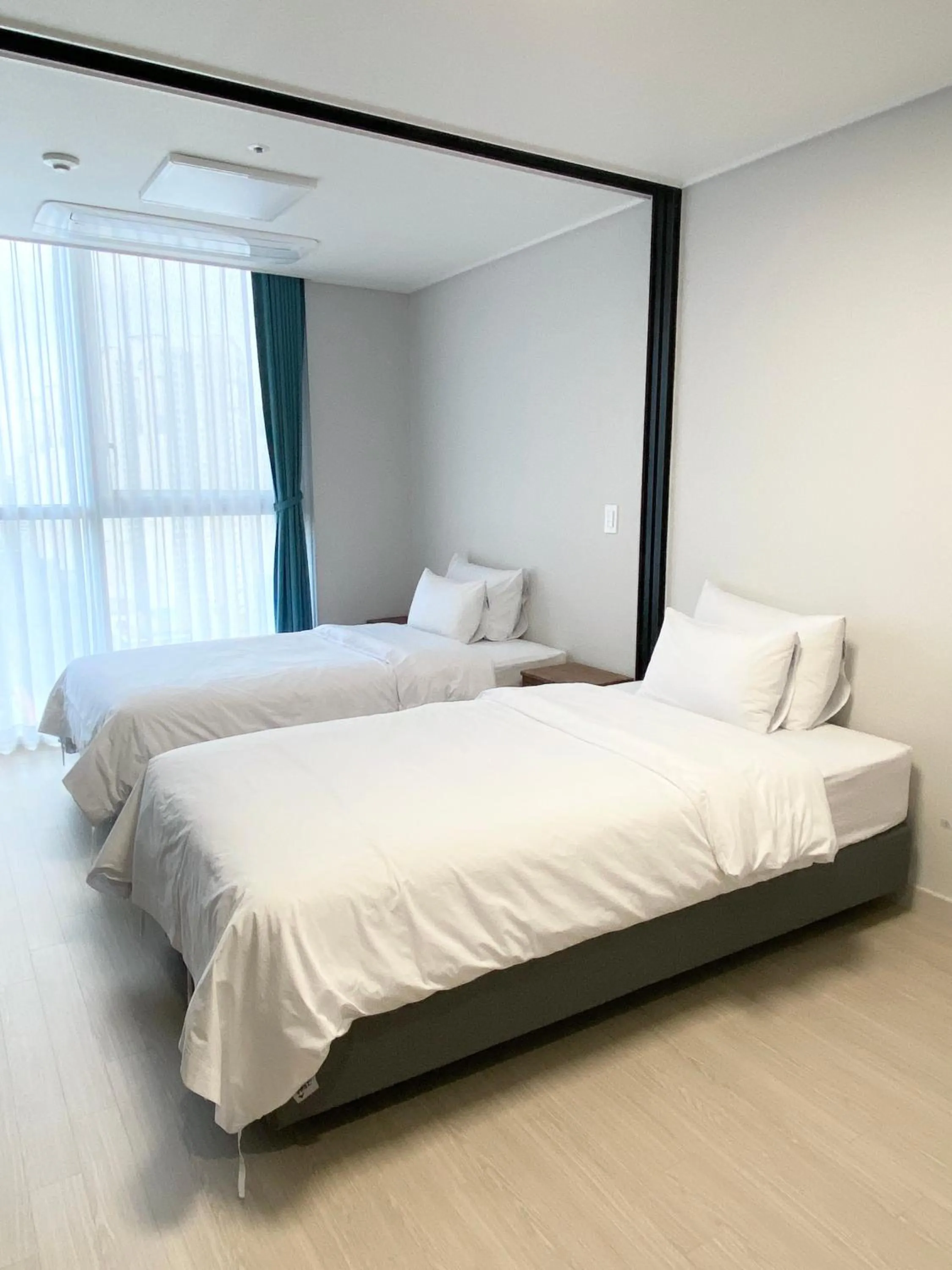 Bed in Grand Bleu Hotel & Residence