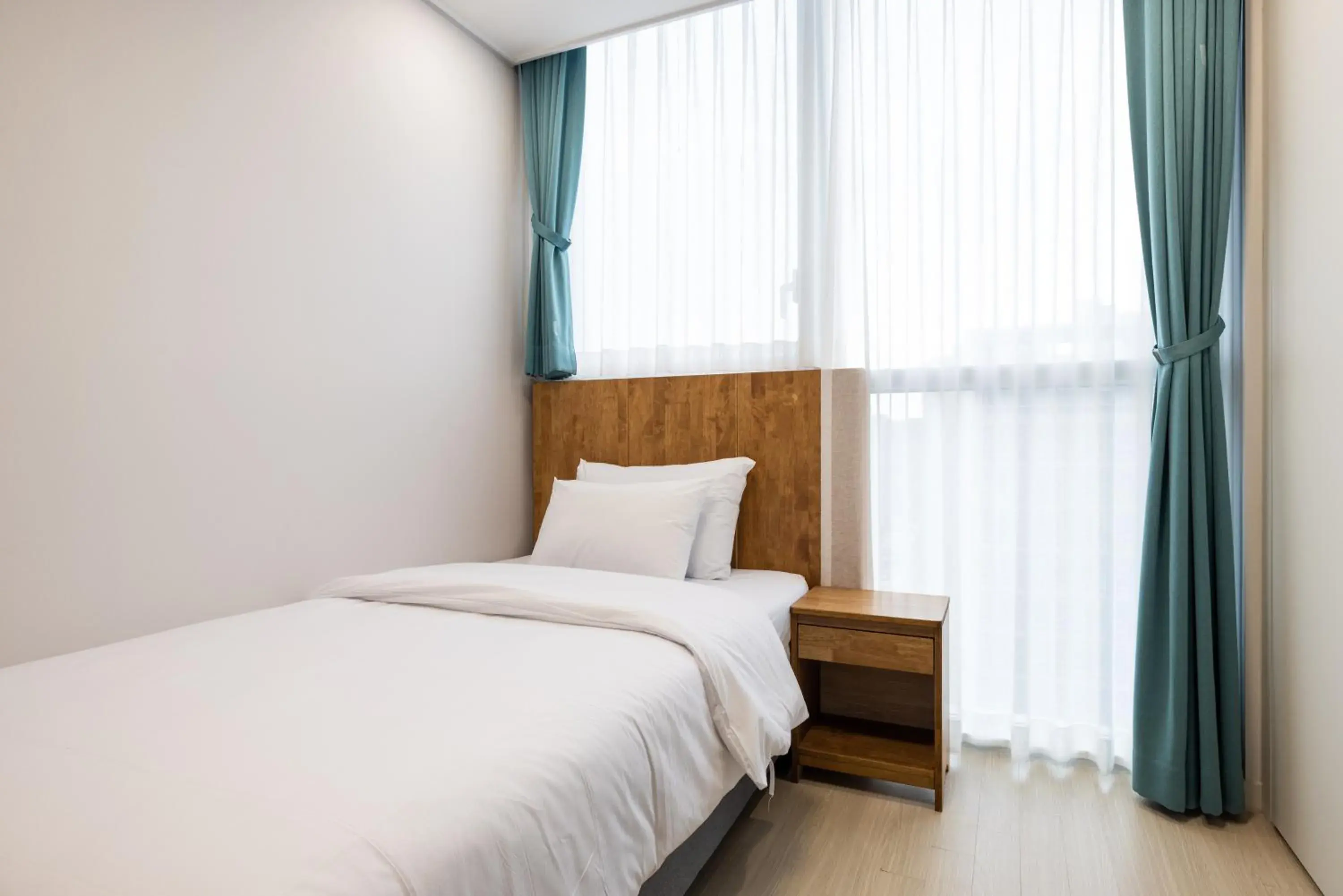 Bed in Grand Bleu Hotel & Residence Bed in Grand Bleu Hotel & Residence