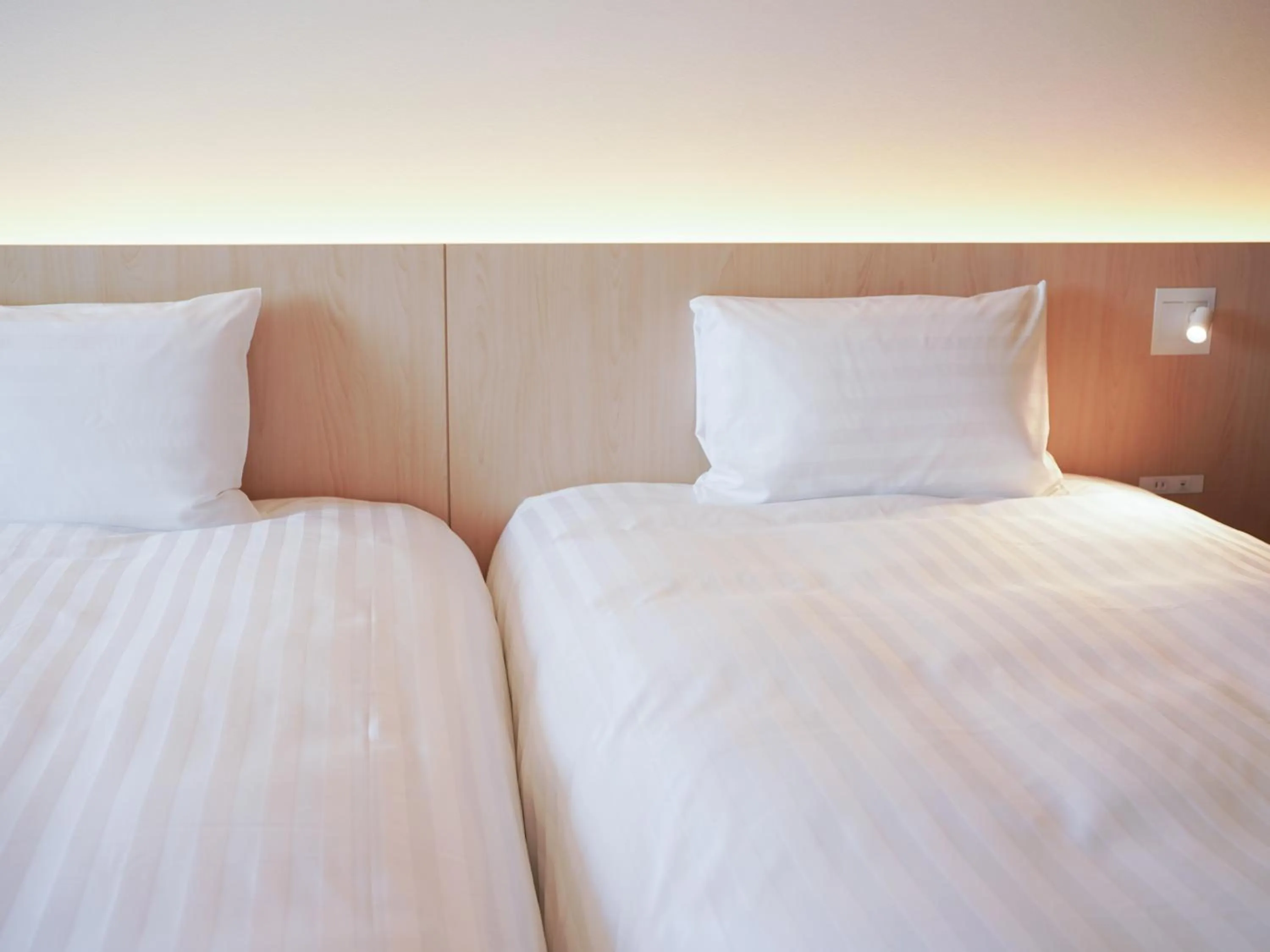 Bed in Dorsett by Agora Osaka Sakai