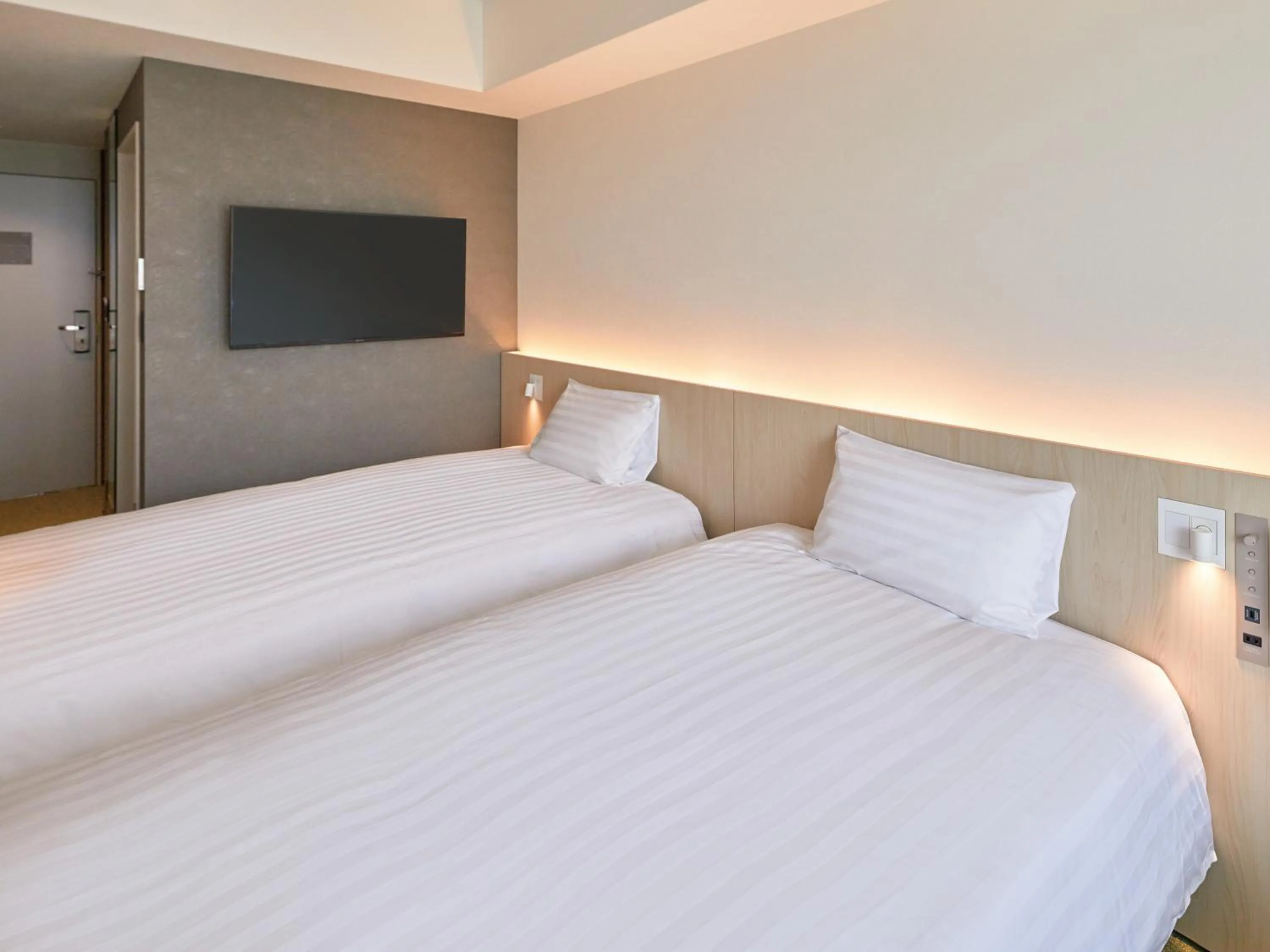 Bed in Dorsett by Agora Osaka Sakai