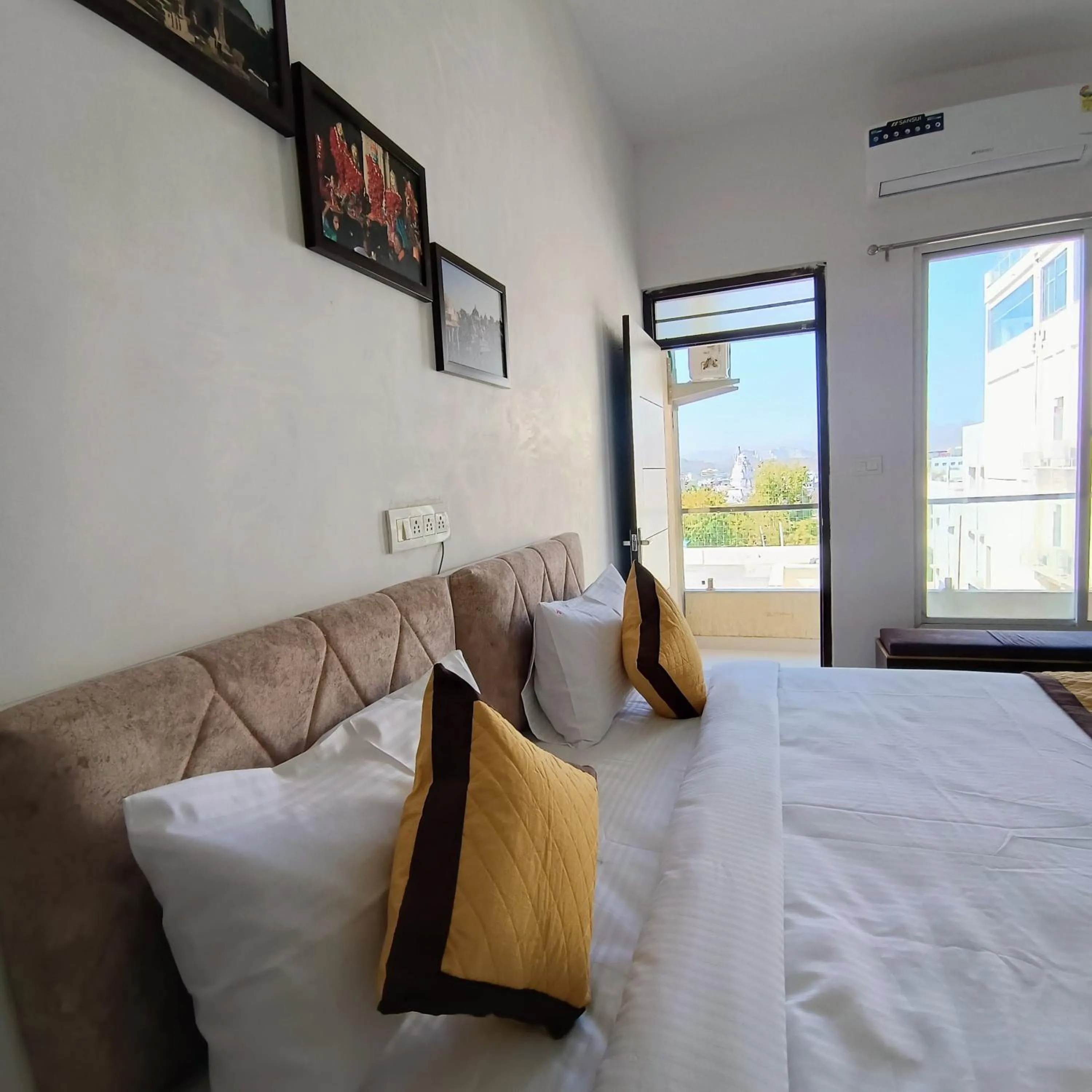 Bed in Arul's Hotel