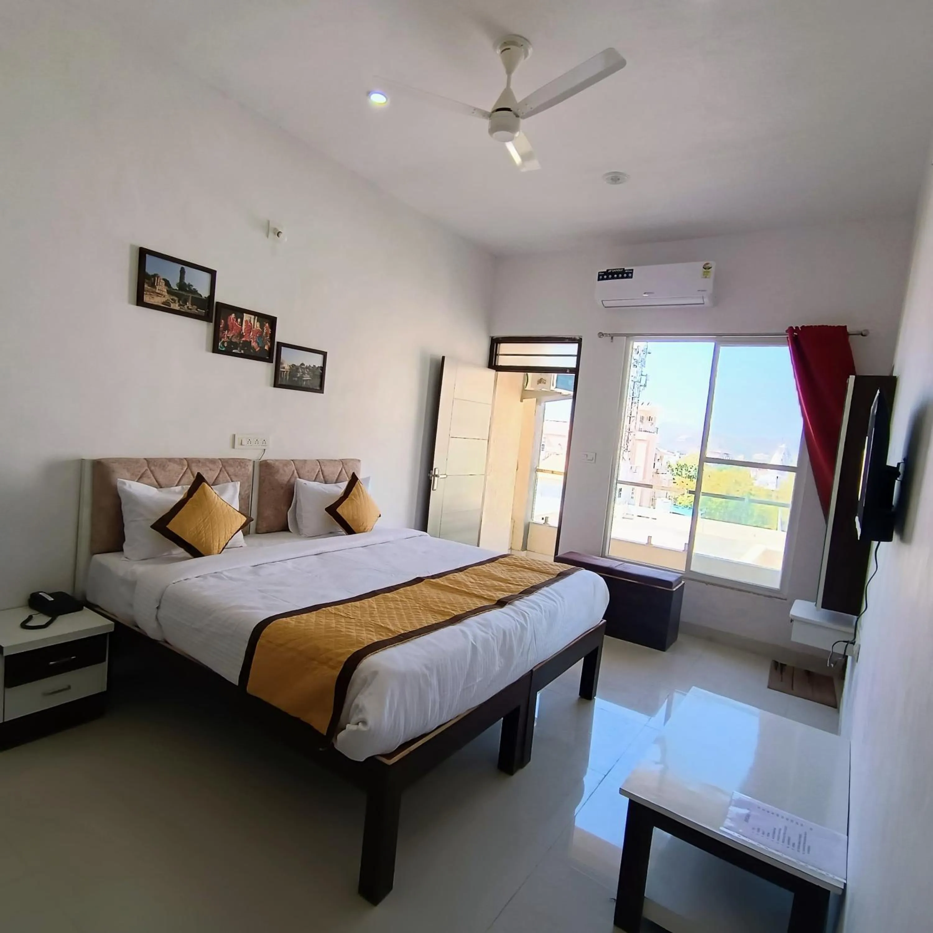 Bed in Arul's Hotel