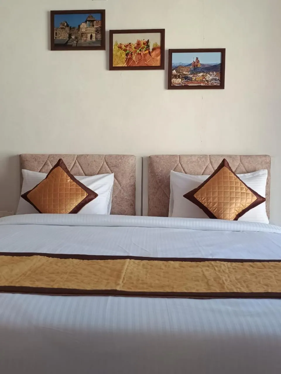 Bed in Arul's Hotel