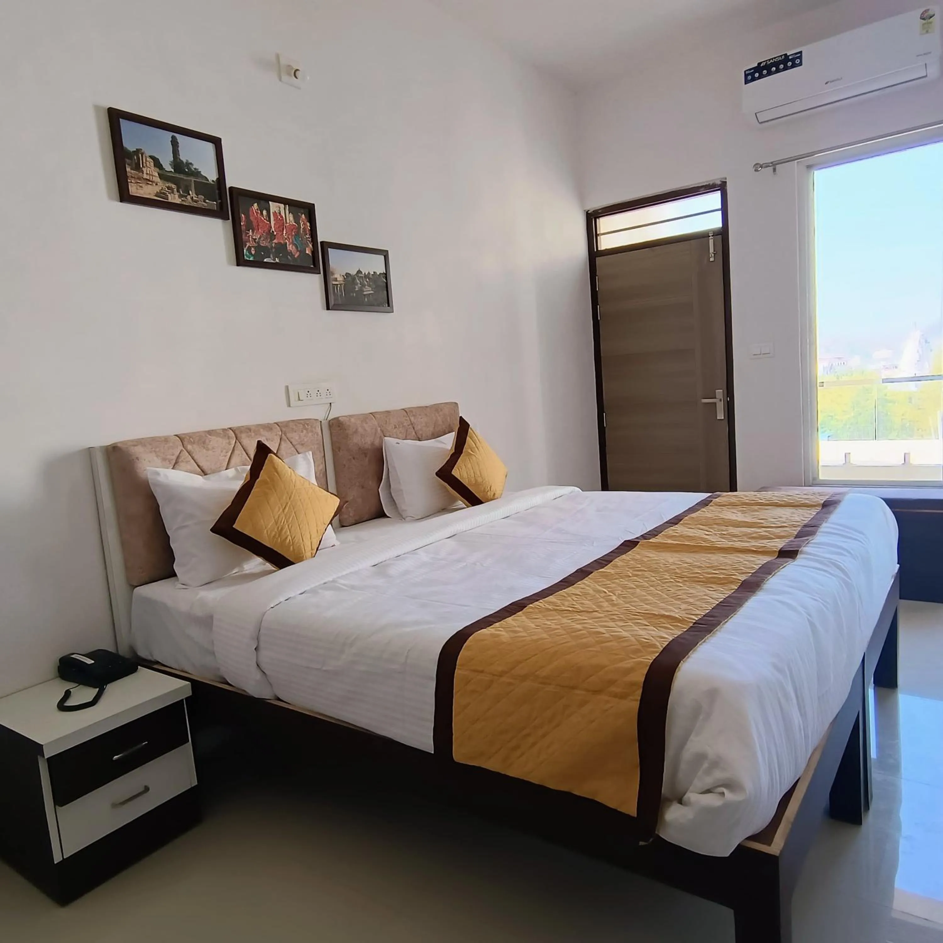 Bed in Arul's Hotel