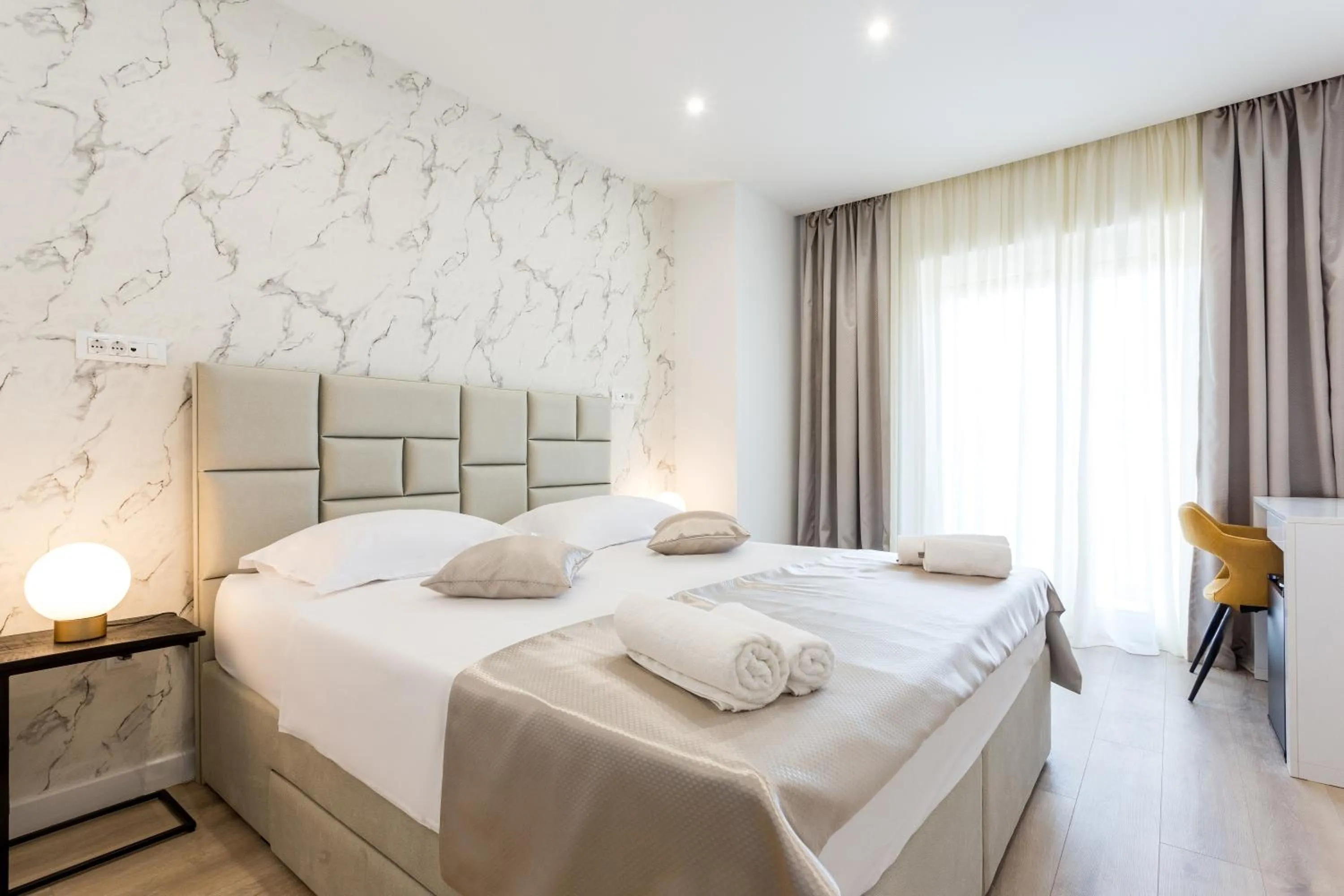 Bed in Shine of Life Luxury Rooms