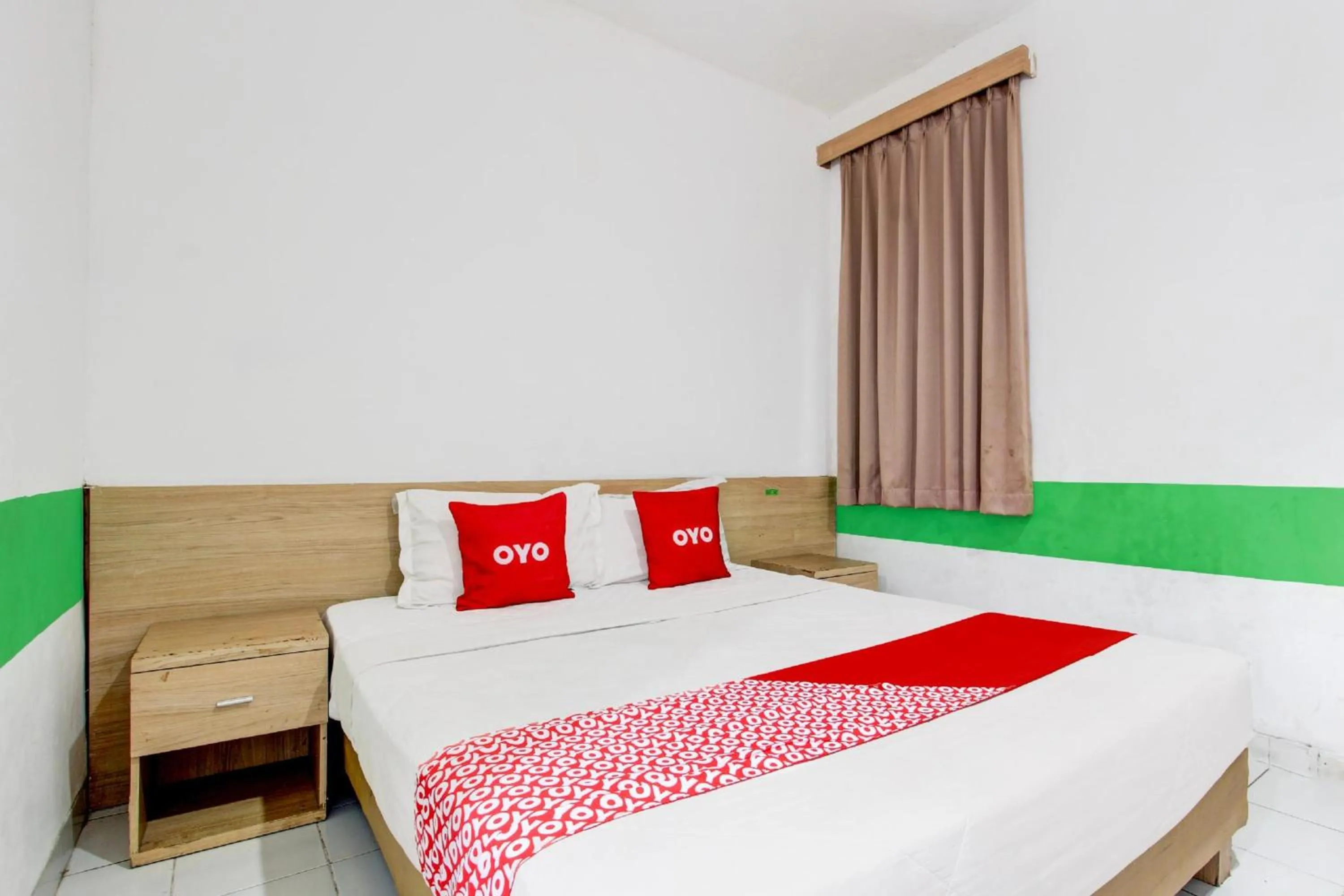 View (from property/room), Bed in Collection O Jalan Slamet Riyadi Near Kampung Batik Kauman Formerly Hotel Grand Kota