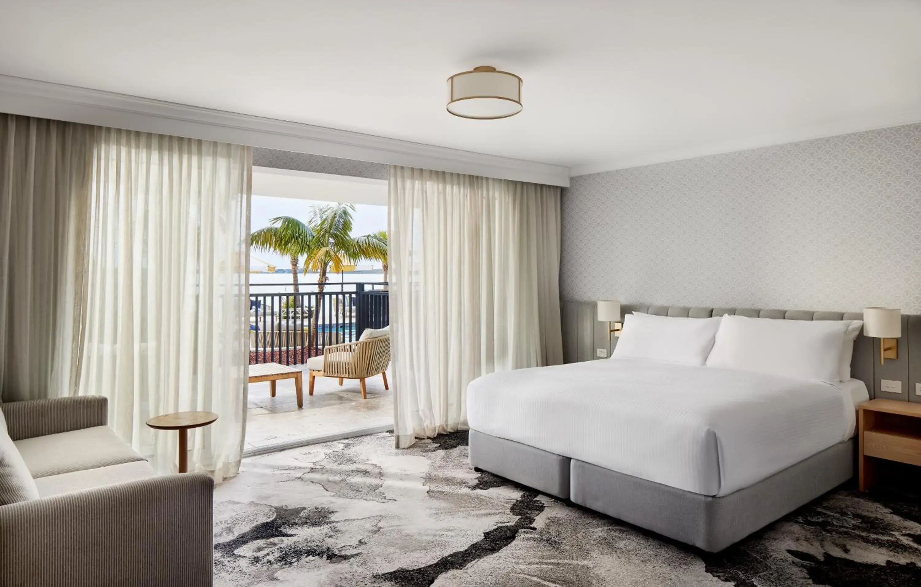 Balcony/Terrace, Bed in The Beachcomber Hotel & Resort, an Ascend Collection Resort Balcony/Terrace, Bed in The Beachcomber Hotel & Resort, an Ascend Collection Resort