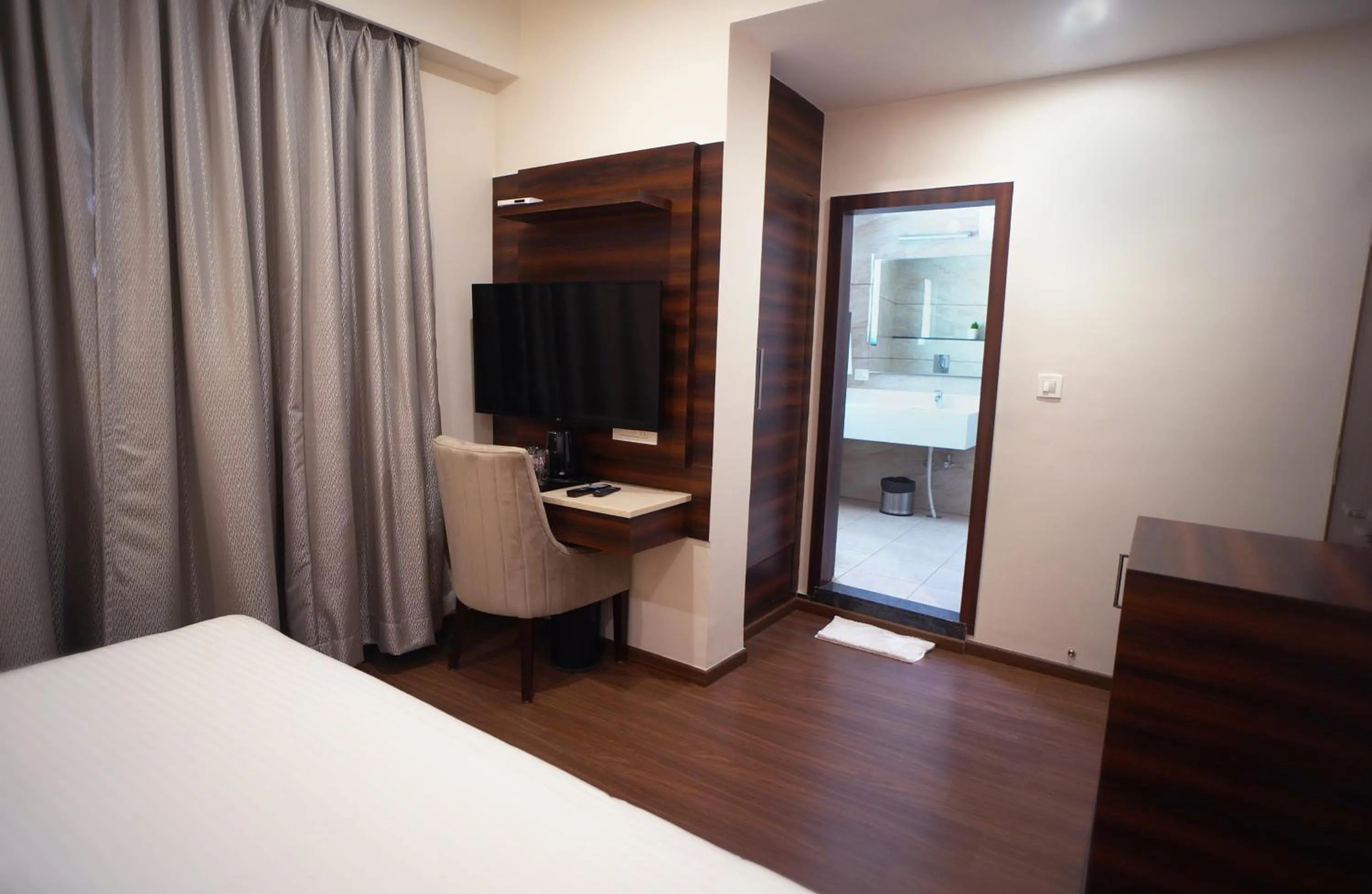 Bedroom, Bed in Sai Maa Hotel & Residency