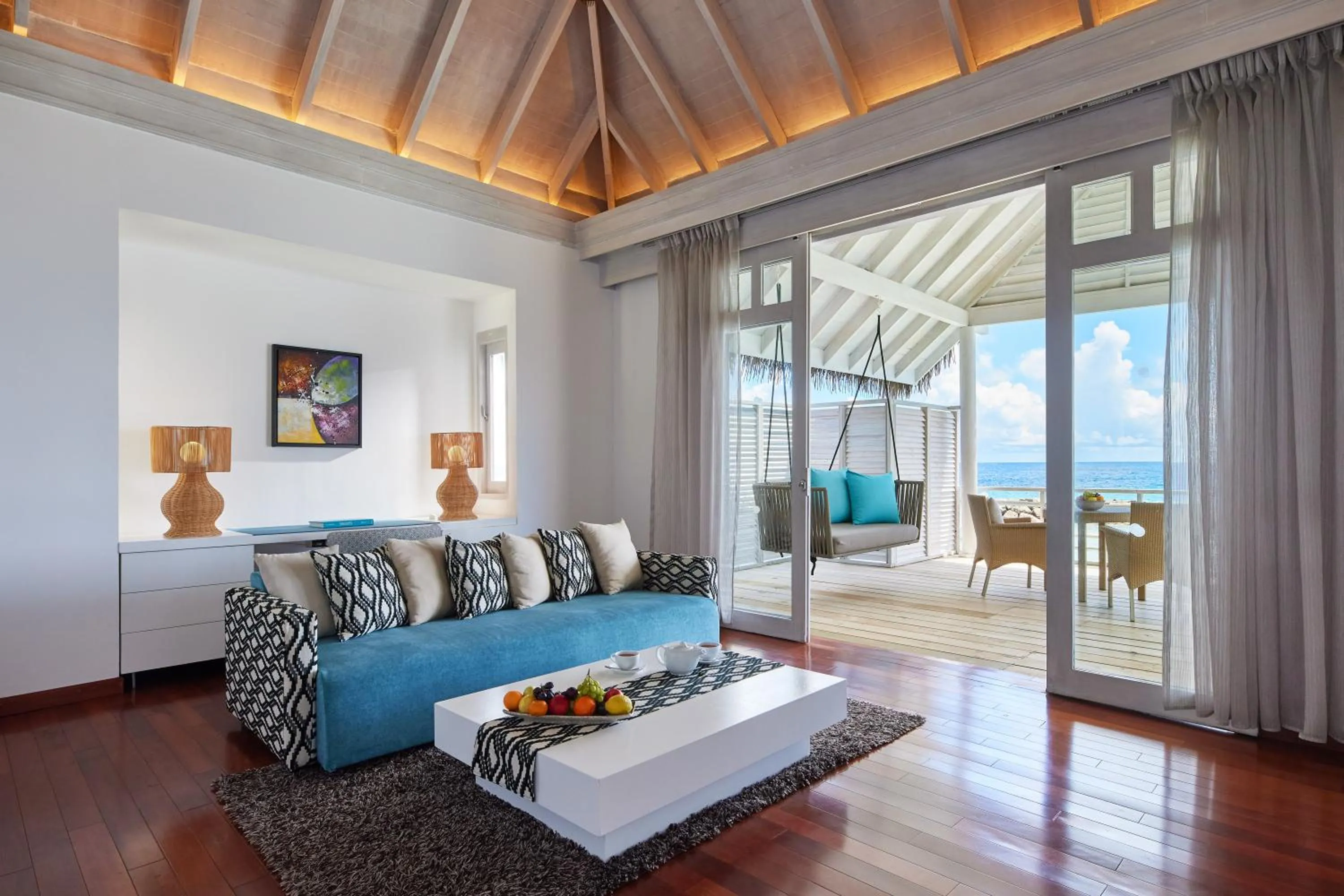 Living room, Bed in NH Maldives Kuda Rah Resort