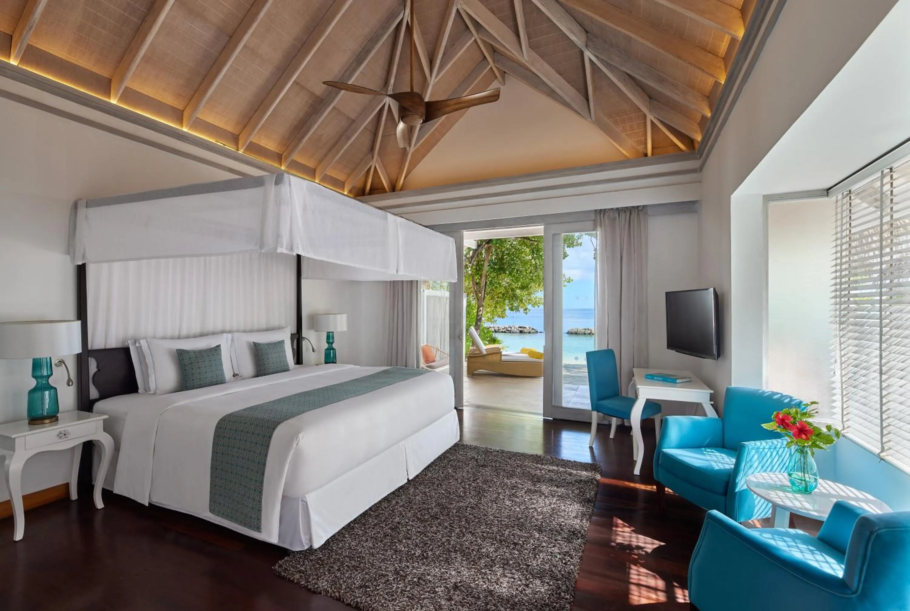Bed in NH Maldives Kuda Rah Resort