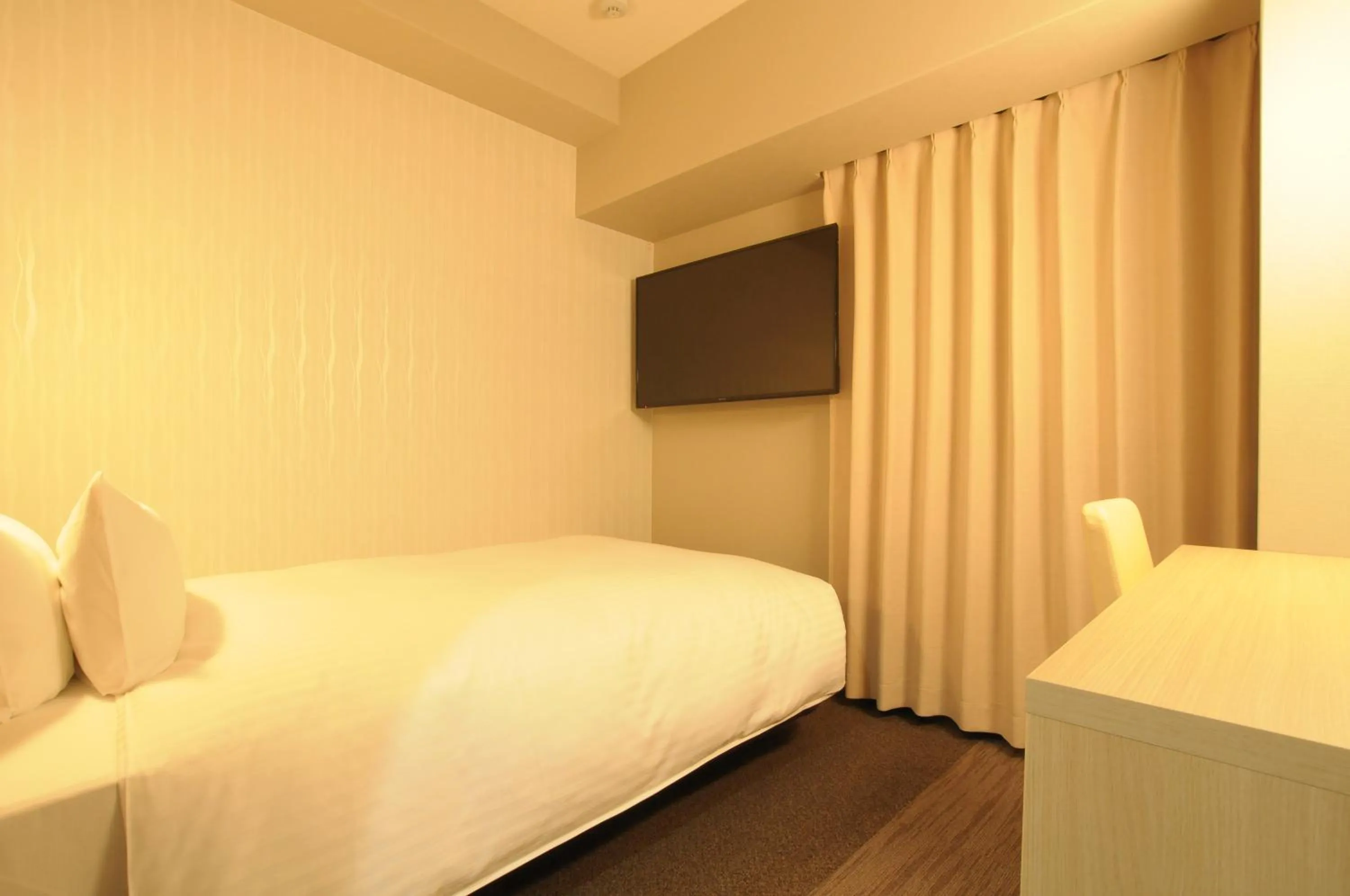 Bed in AB Hotel Tahara