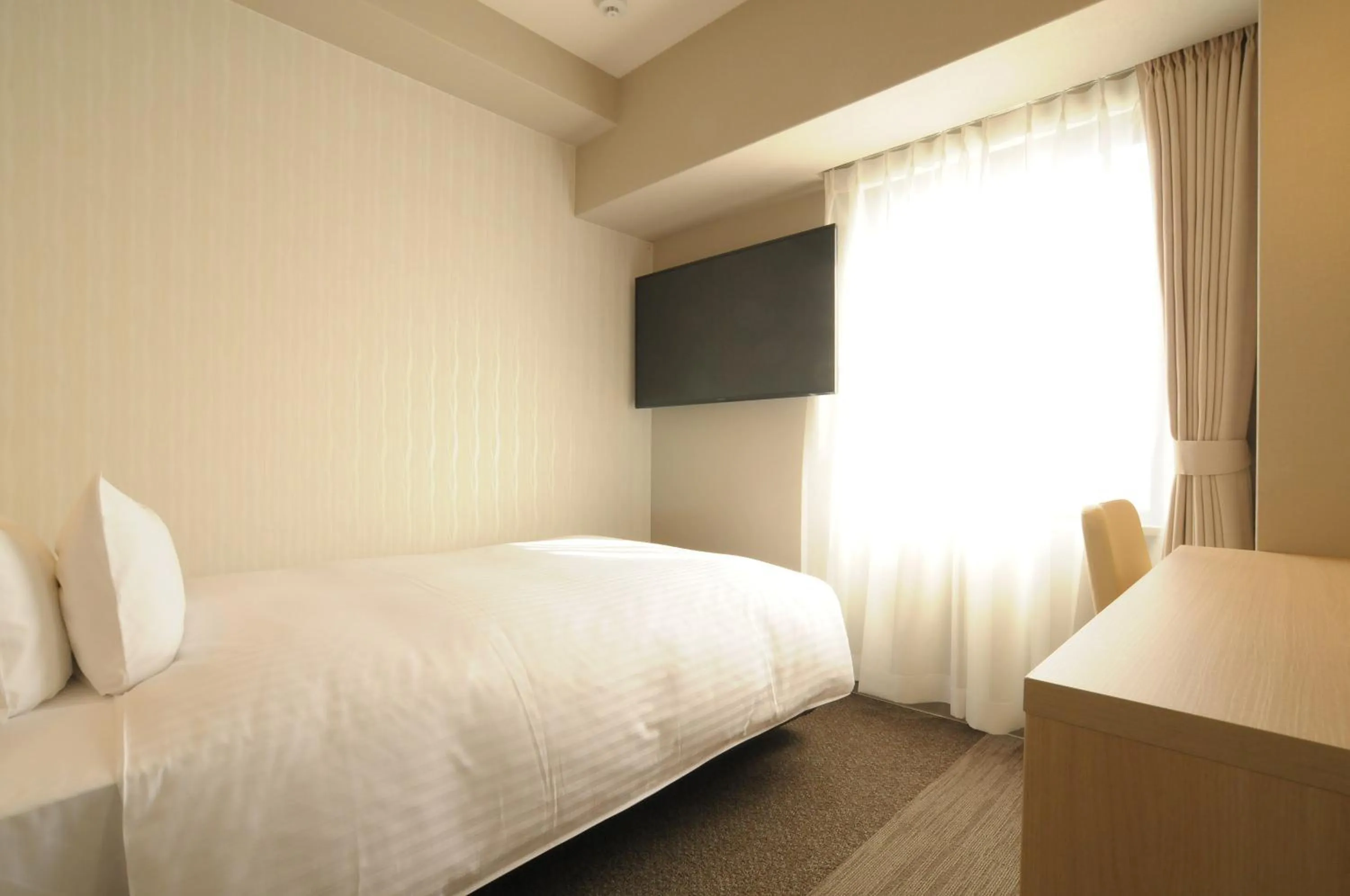 Bed in AB Hotel Tahara