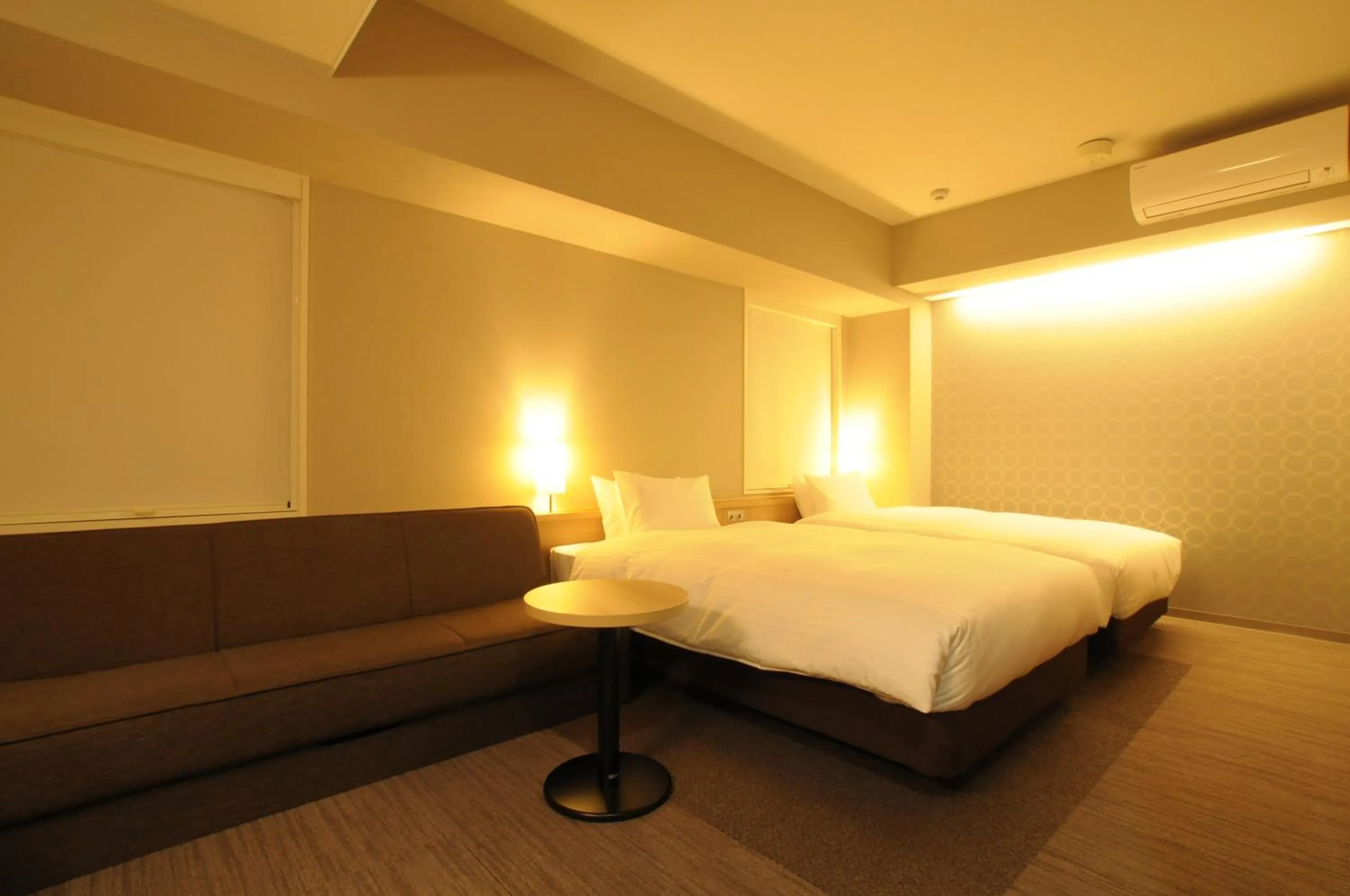 Bed in AB Hotel Tahara