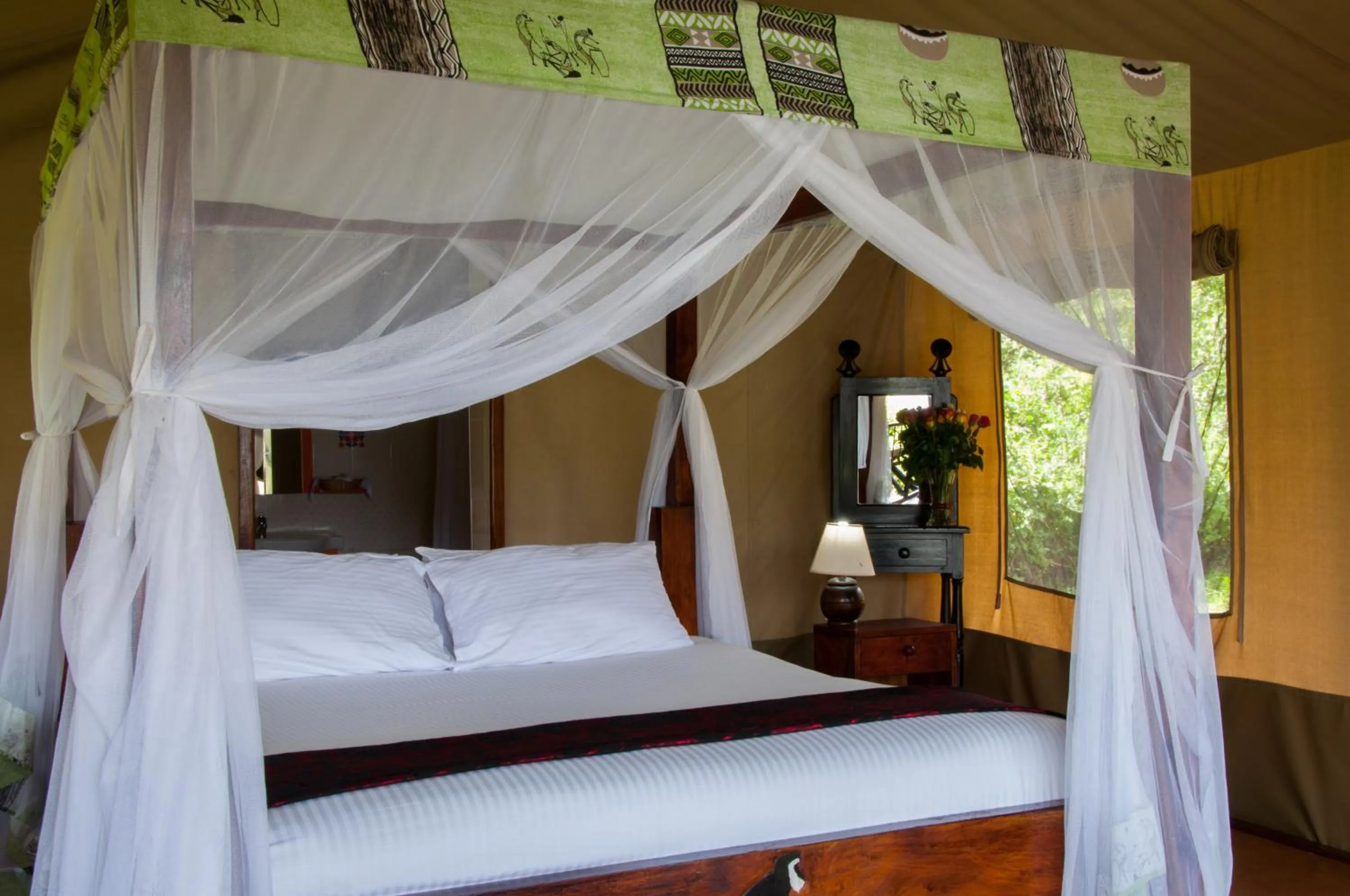 Bed in Crater Lake Tented Camp And Game Sanctuary