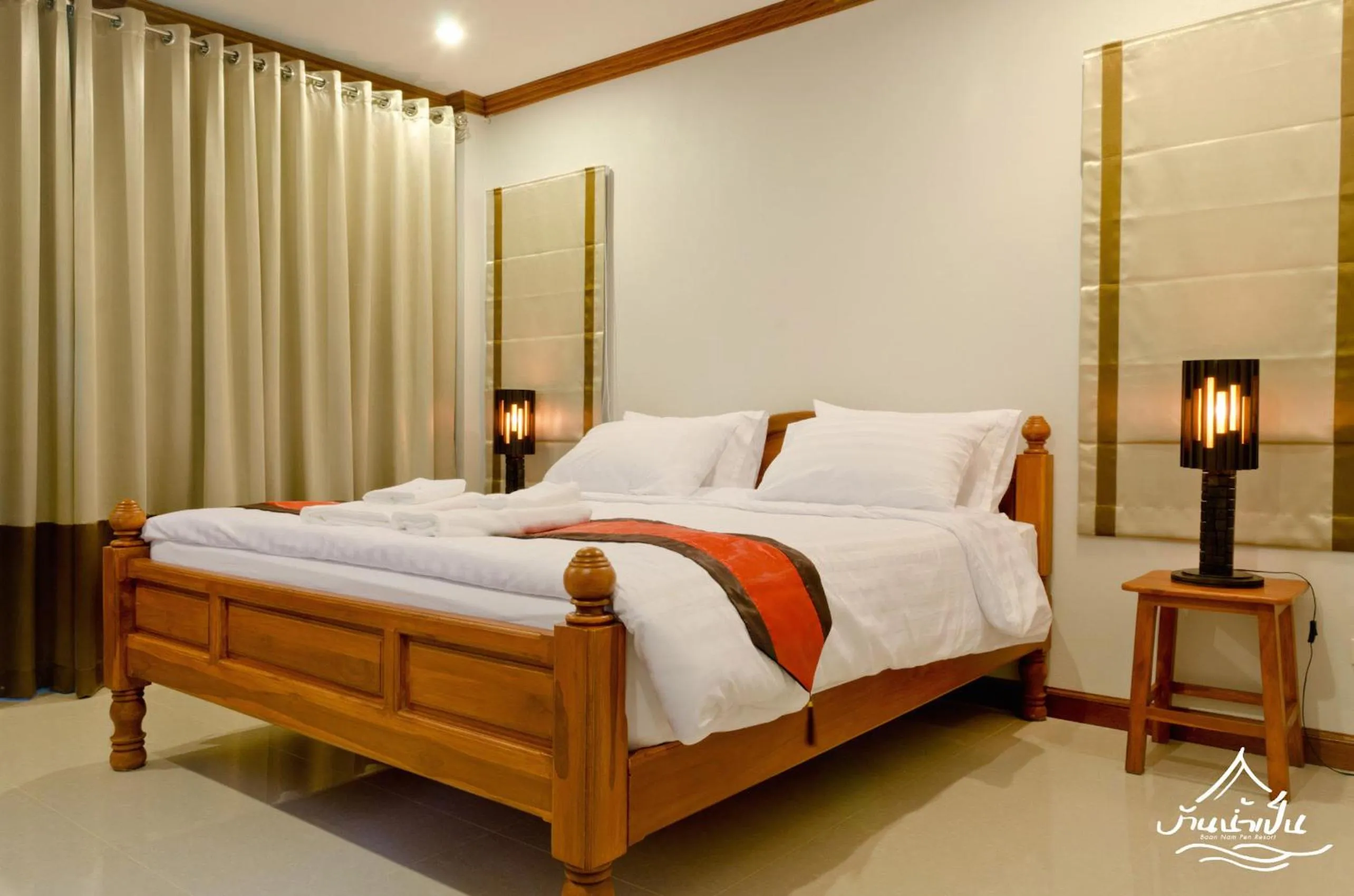 Bed in Baan Nam Pen Resort