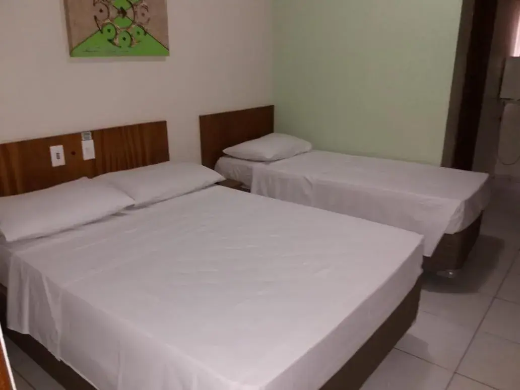 Bed in Ipê Guaru Hotel Bed in Ipê Guaru Hotel