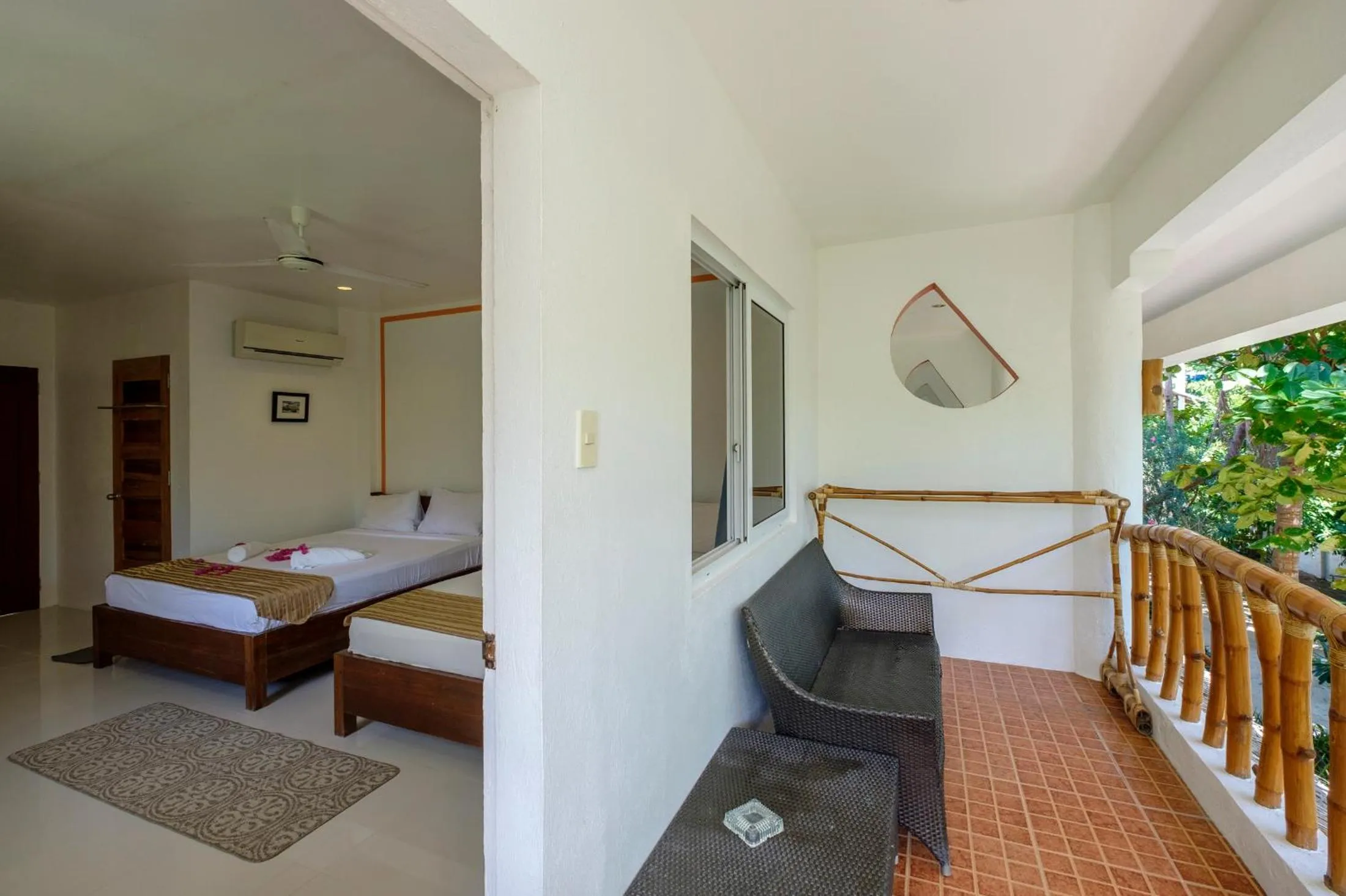 Balcony/Terrace, Bed in Evolution Dive and Beach Resort