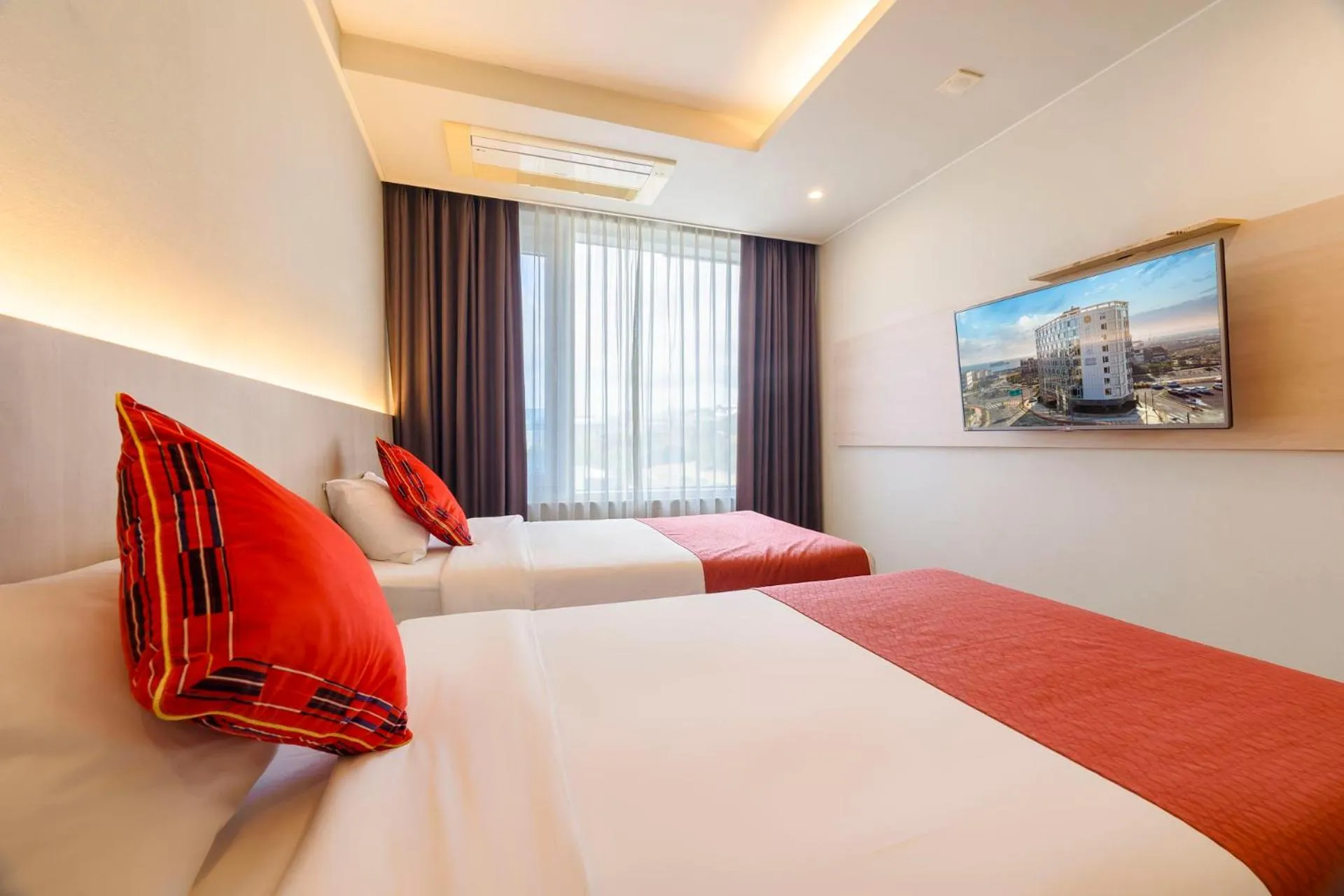 Bed in Shin Shin Hotel Jeju Worldcup