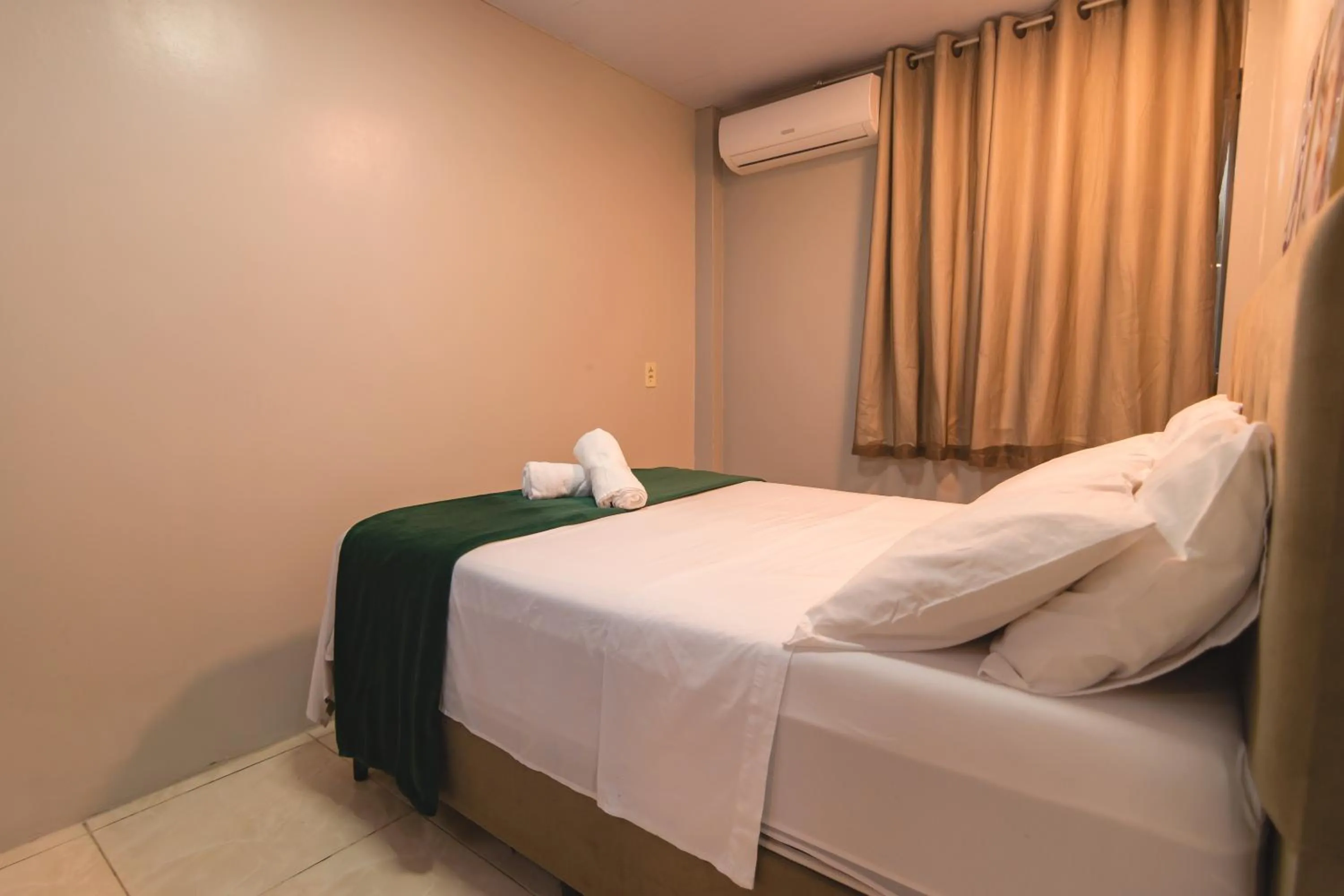 Bed in Flat Flores de Bombinhas Oficial