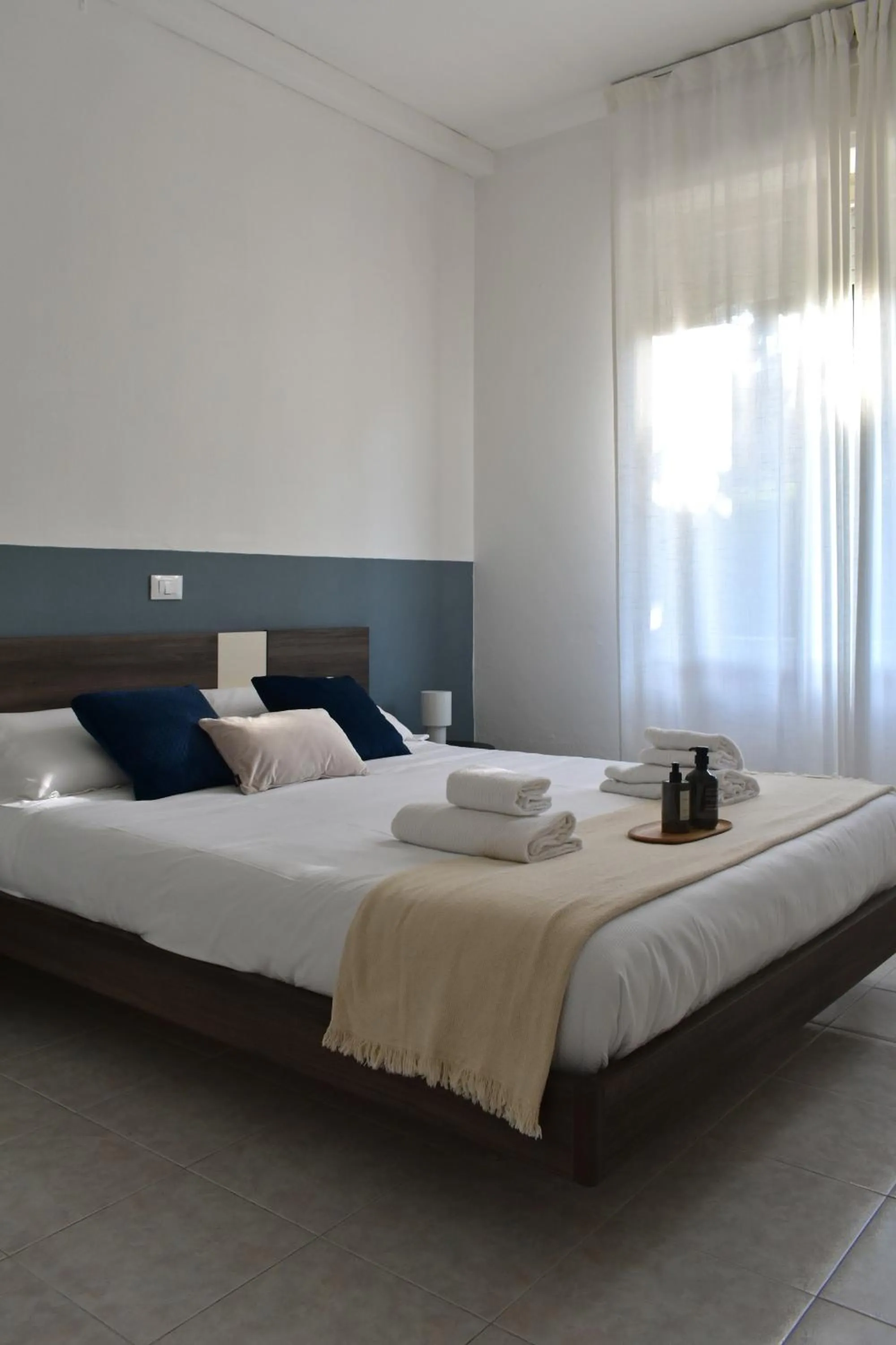 Bed in Poggio Al Lago Apartments & Rooms