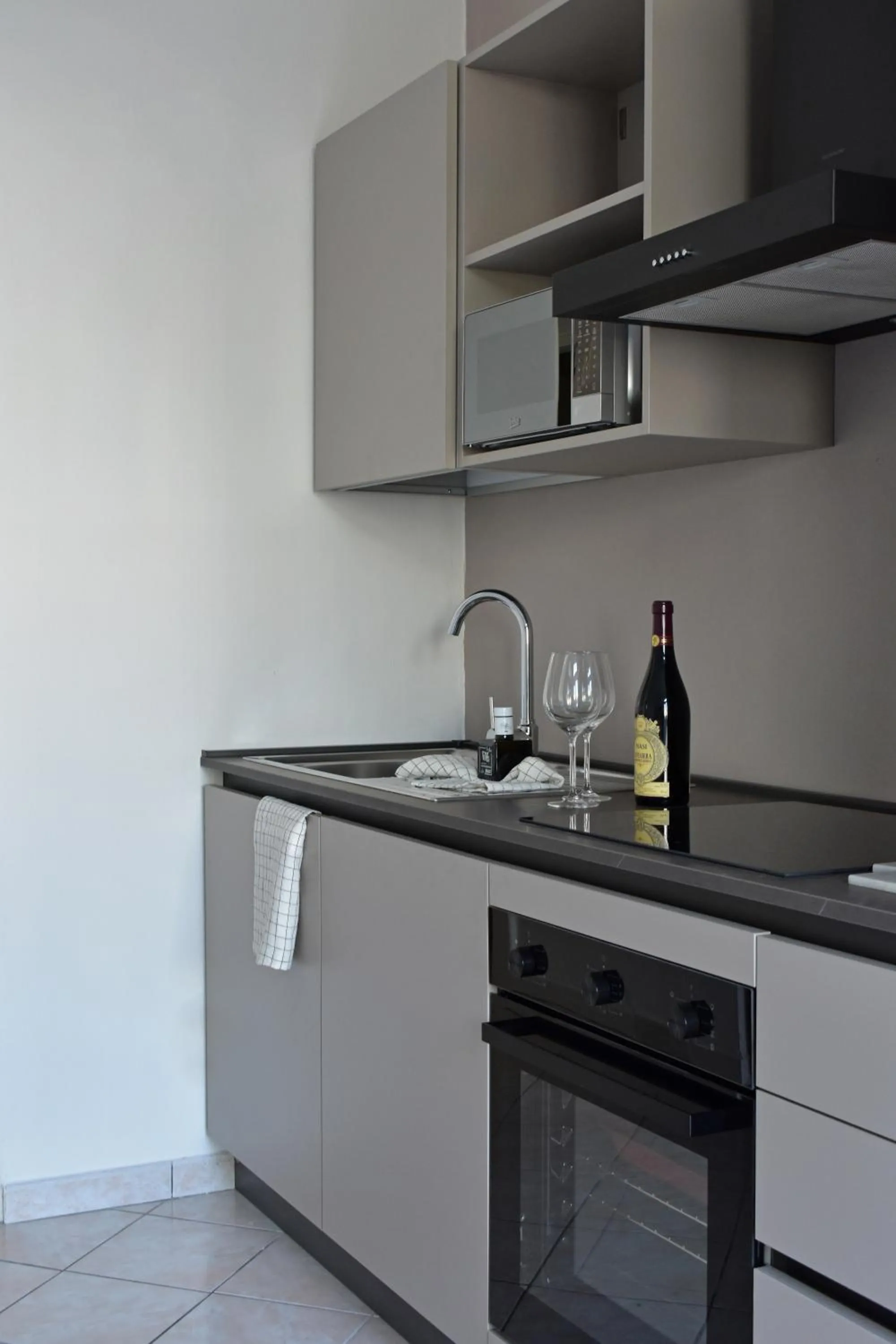 stove in Poggio Al Lago Apartments & Rooms