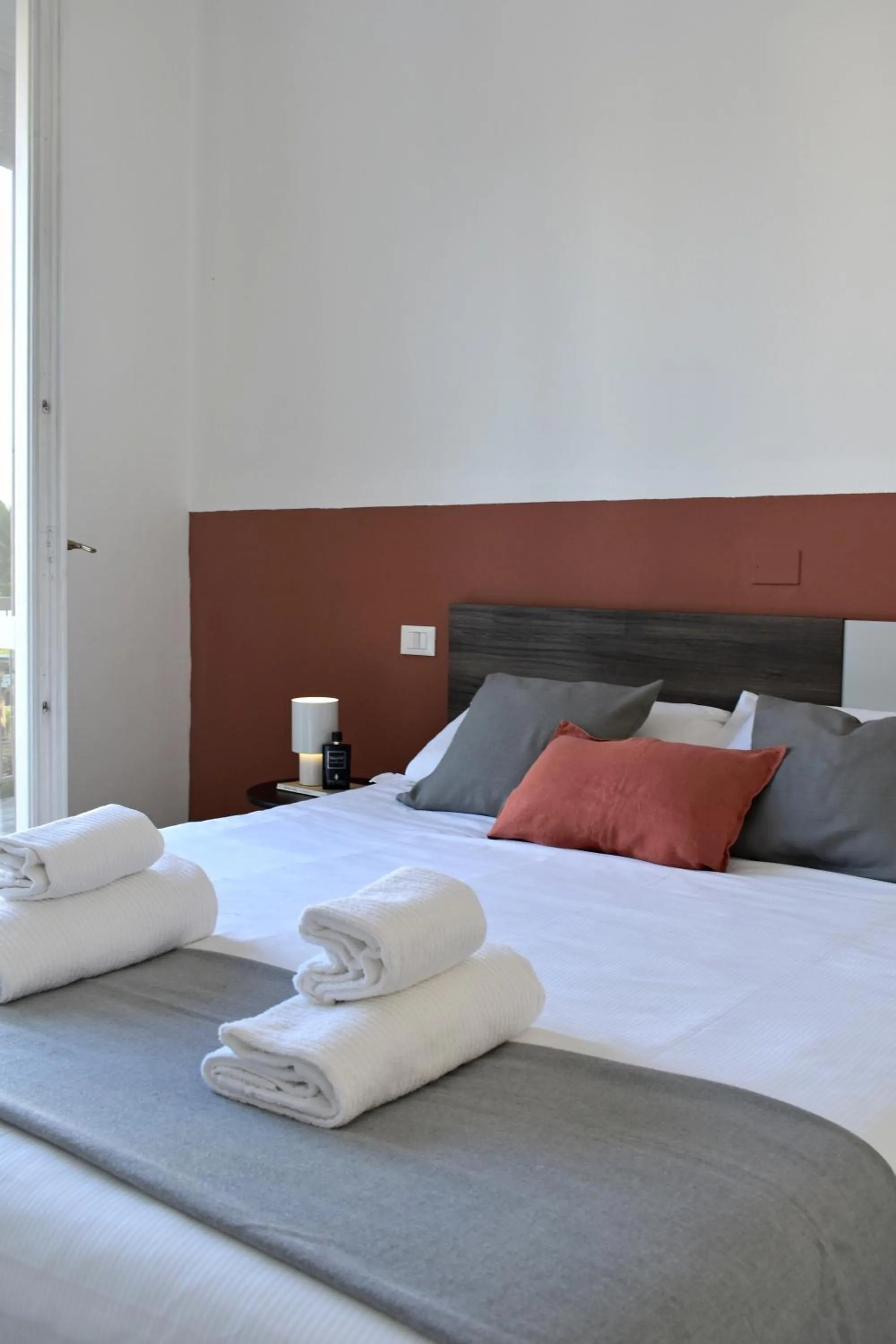 Bed in Poggio Al Lago Apartments & Rooms