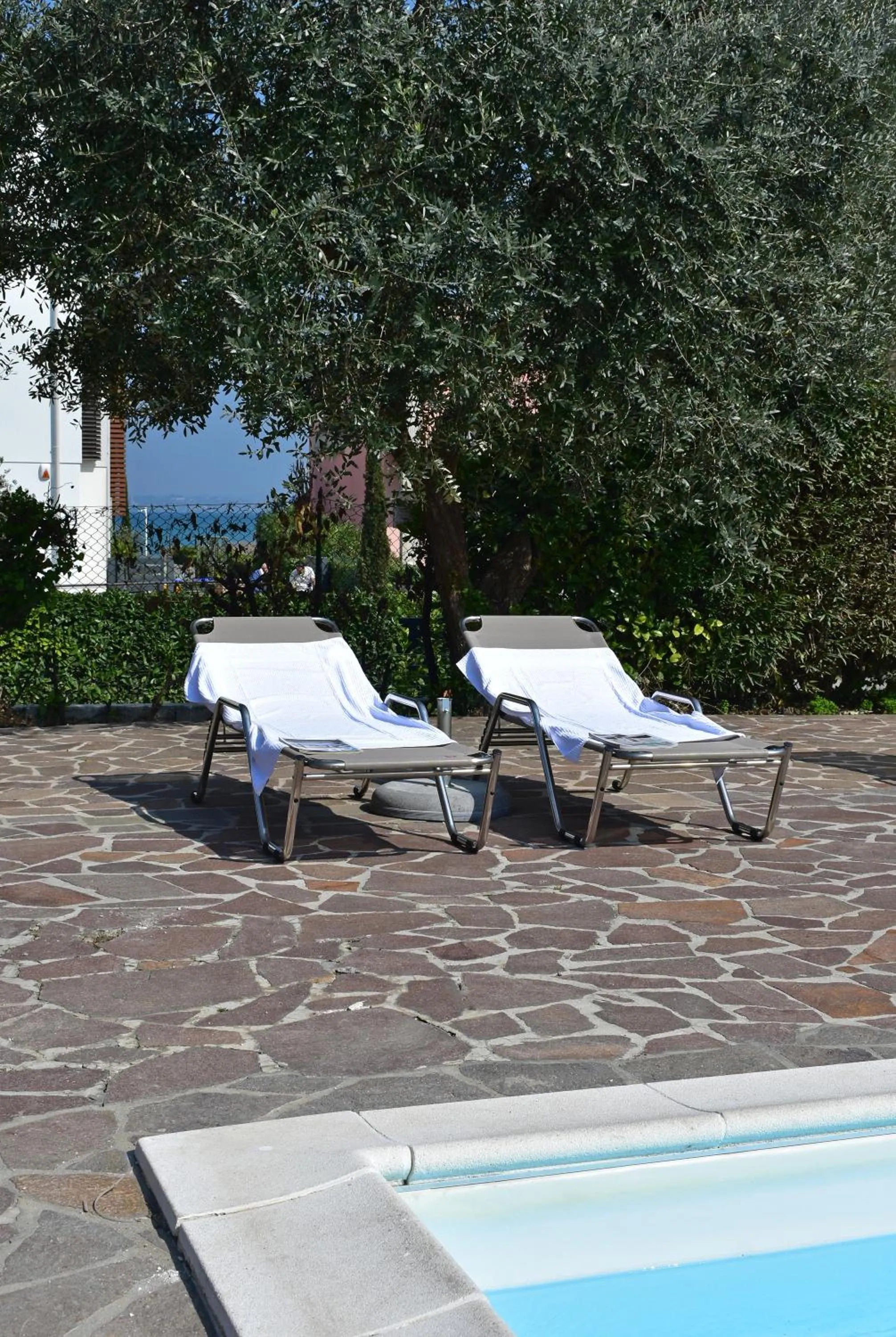 sunbed in Poggio Al Lago Apartments & Rooms