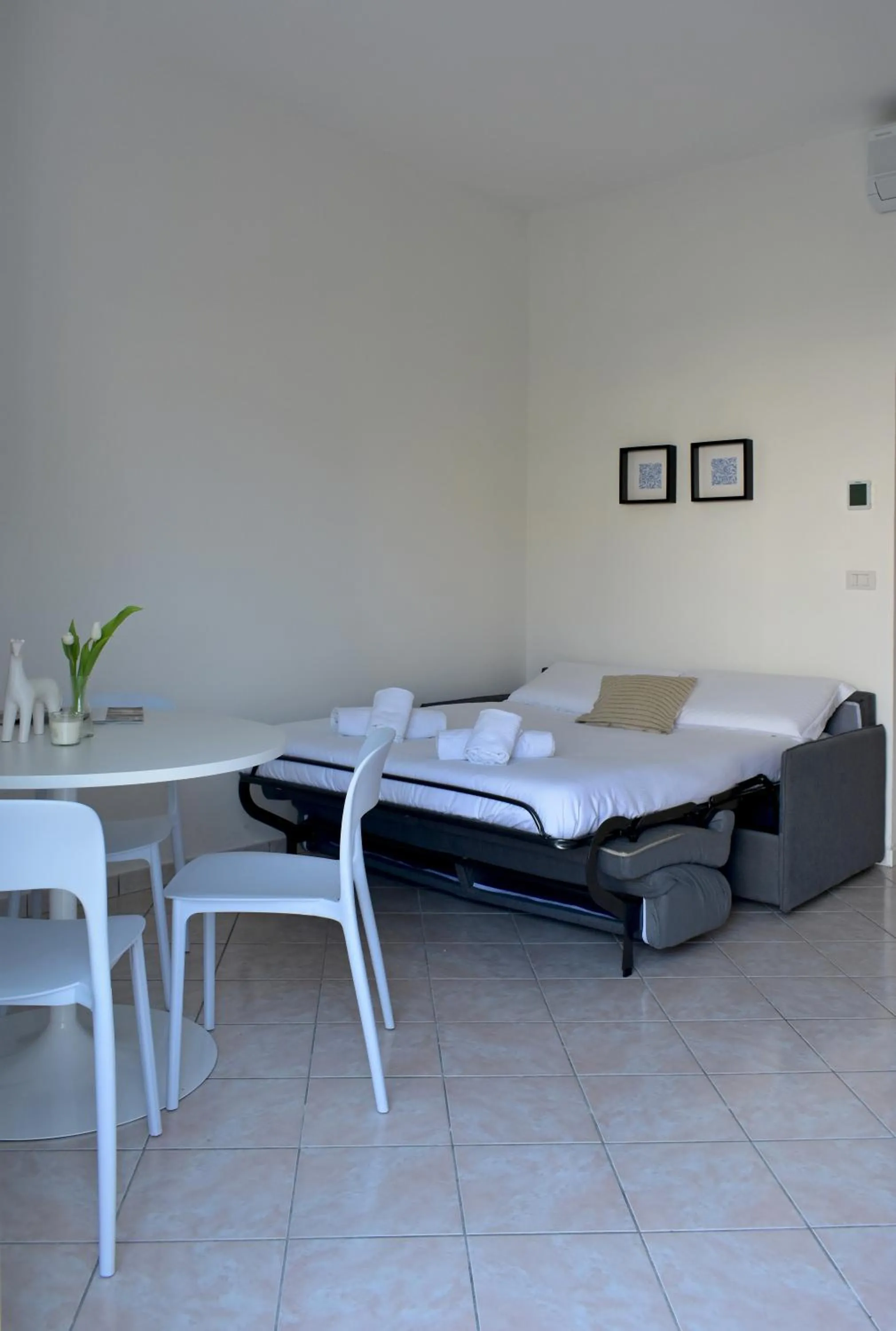 Bed in Poggio Al Lago Apartments & Rooms