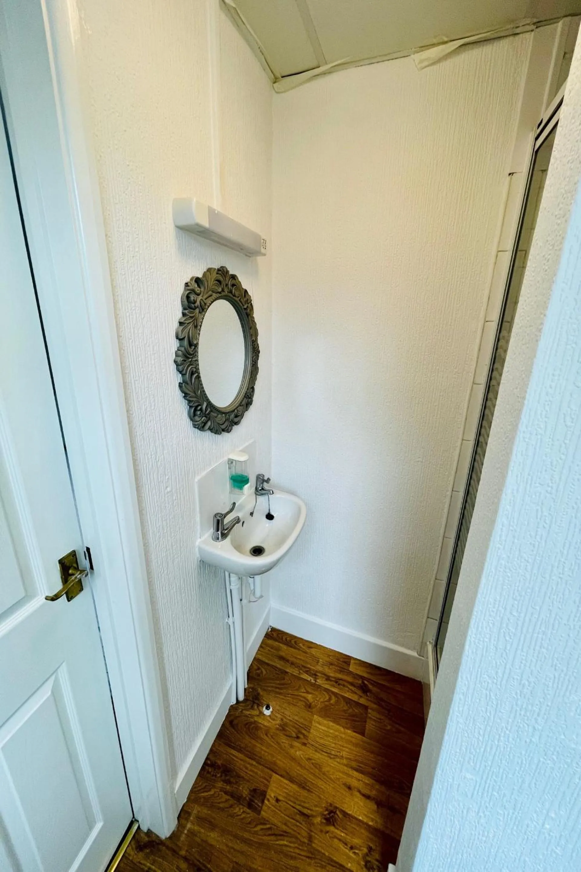 Bathroom in OYO The Sun Hotel