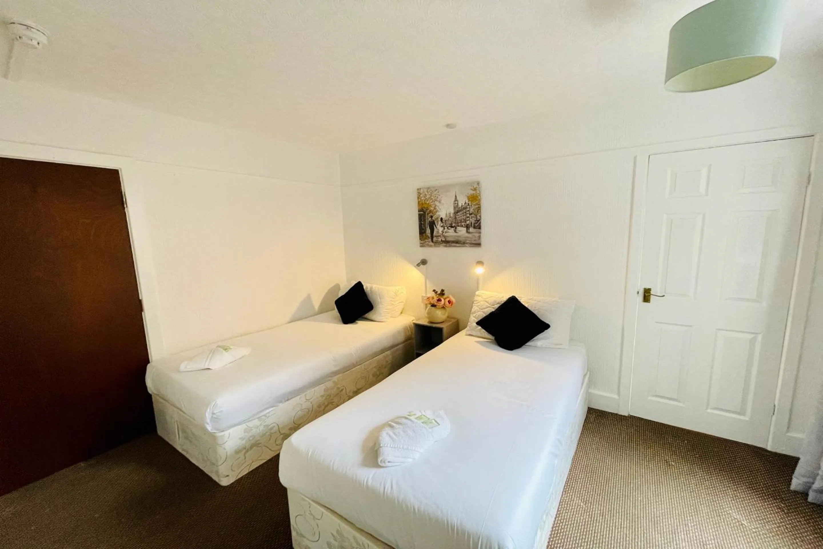 Bedroom in OYO The Sun Hotel