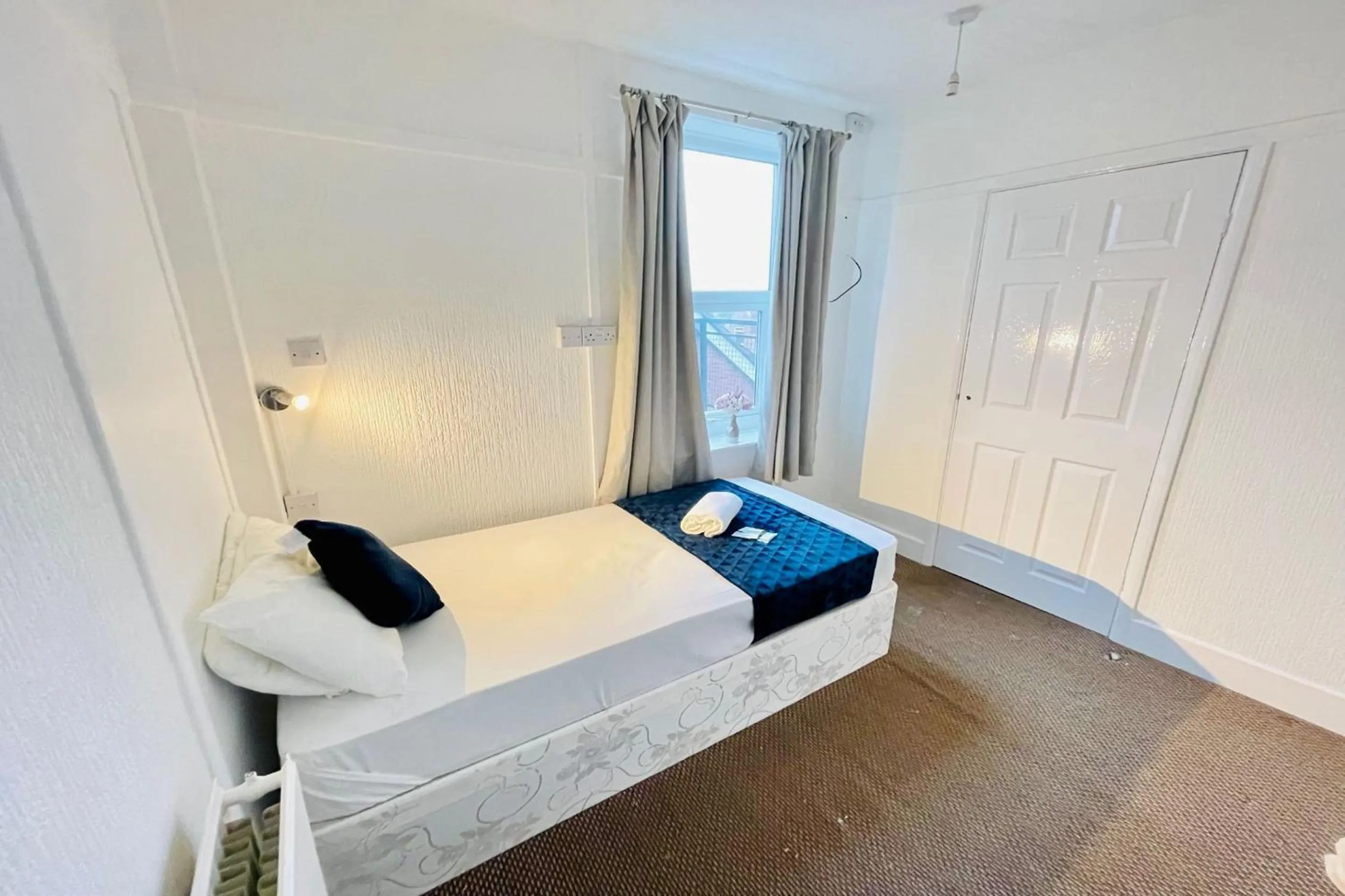 Bedroom in OYO The Sun Hotel