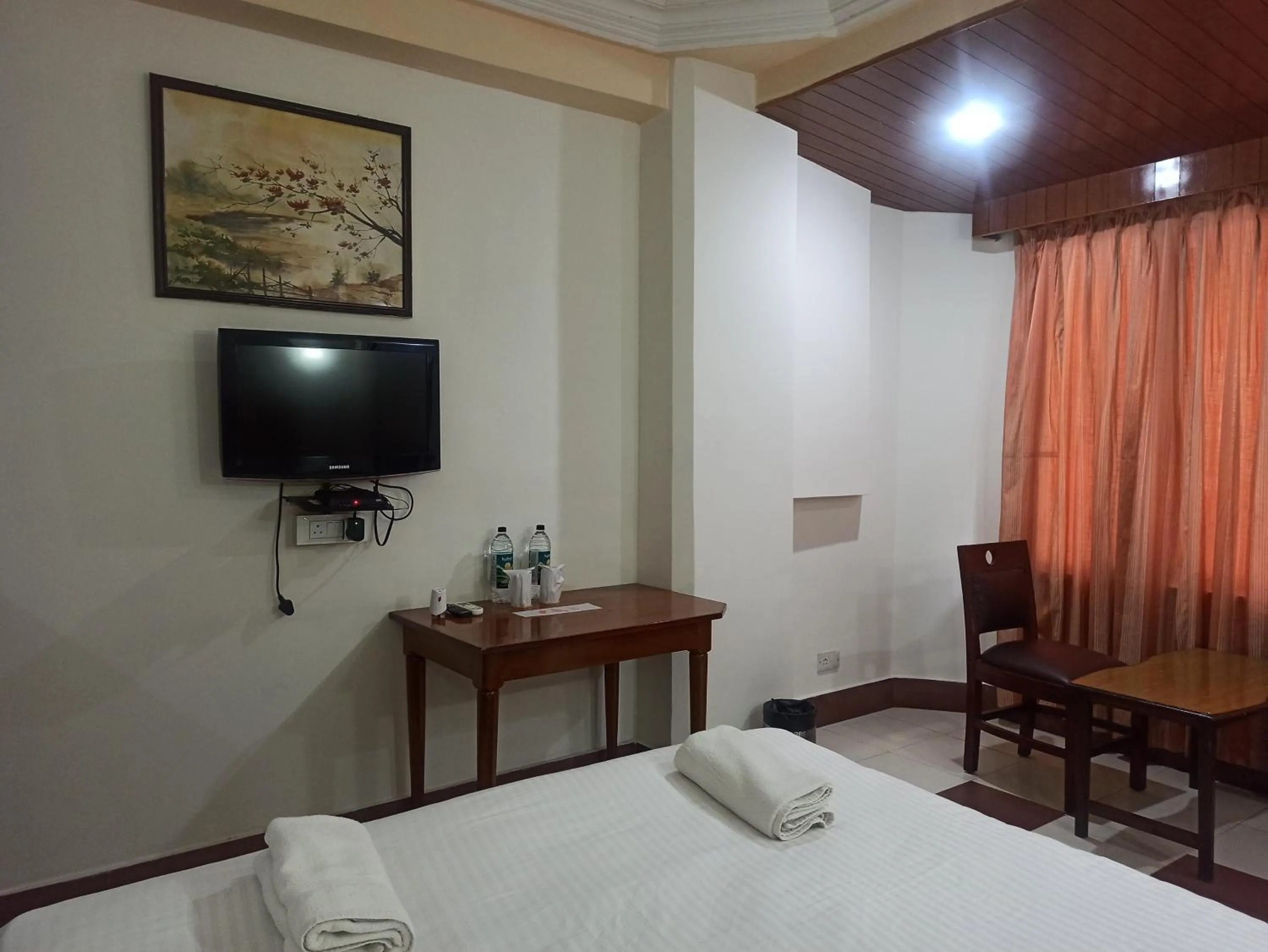 Bedroom in Hotel Ambarish Grand Residency