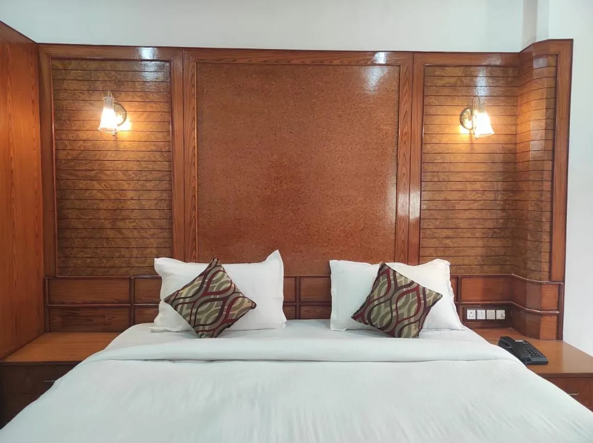 Bed in Hotel Ambarish Grand Residency
