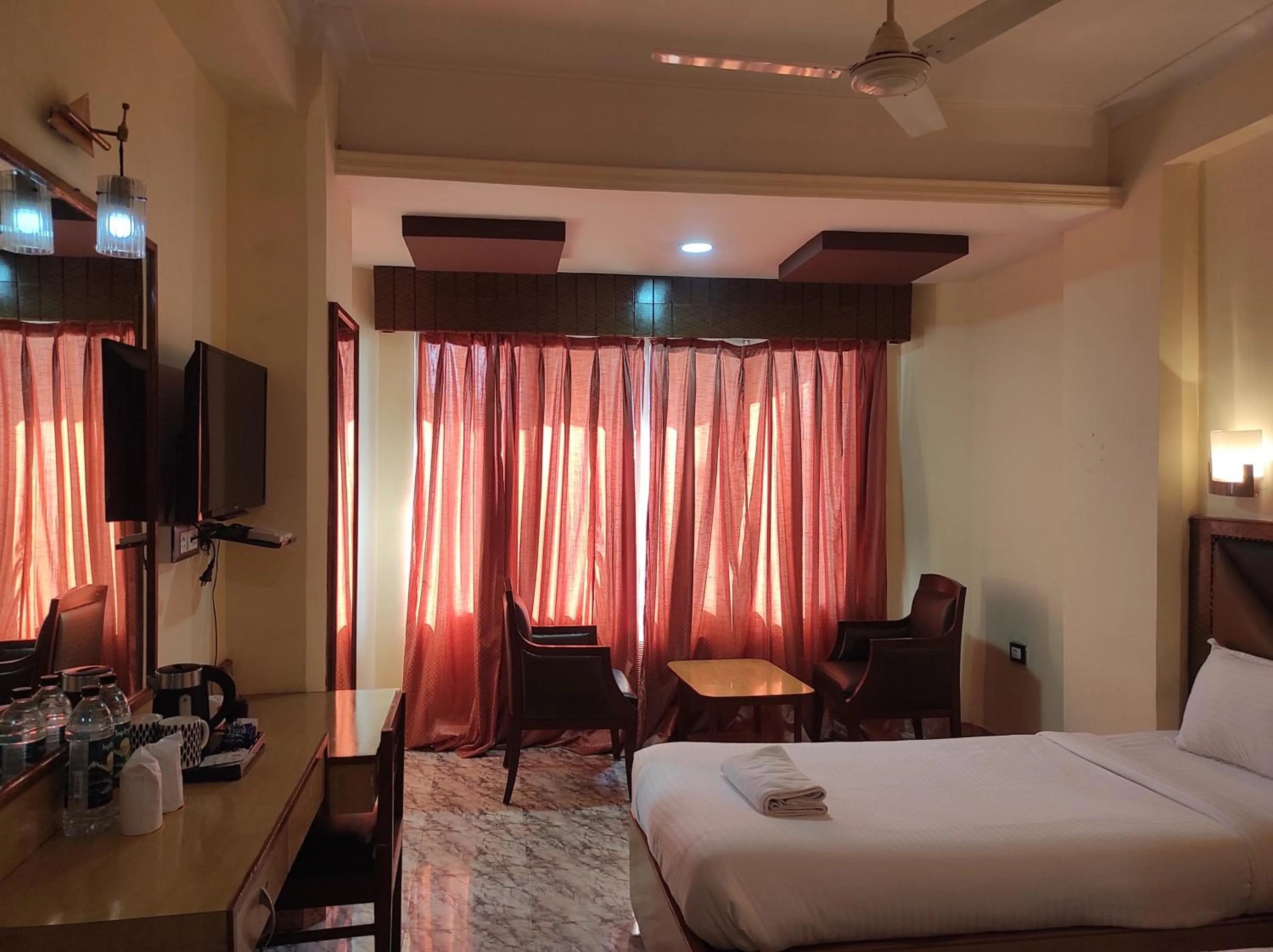 Bedroom in Hotel Ambarish Grand Residency