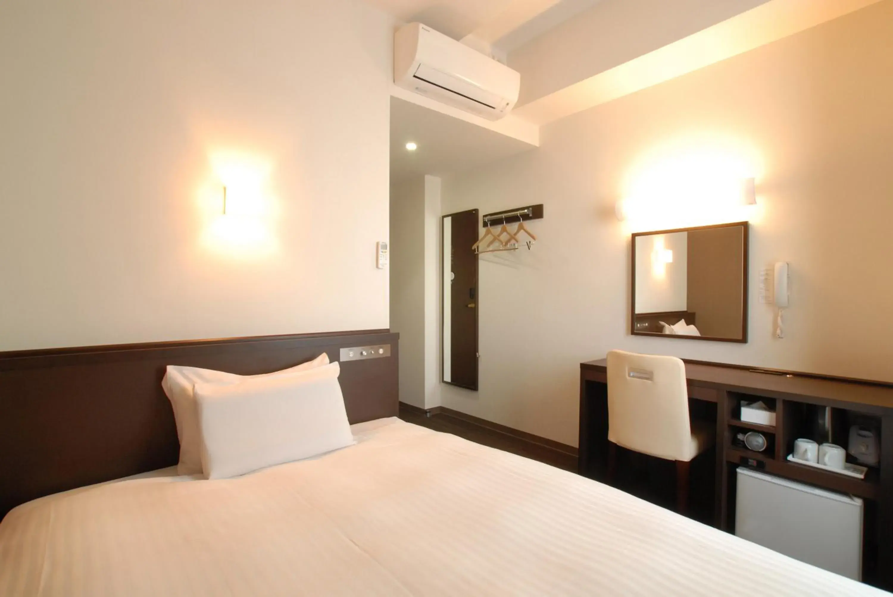 Bed in AB Hotel Komaki Bed in AB Hotel Komaki