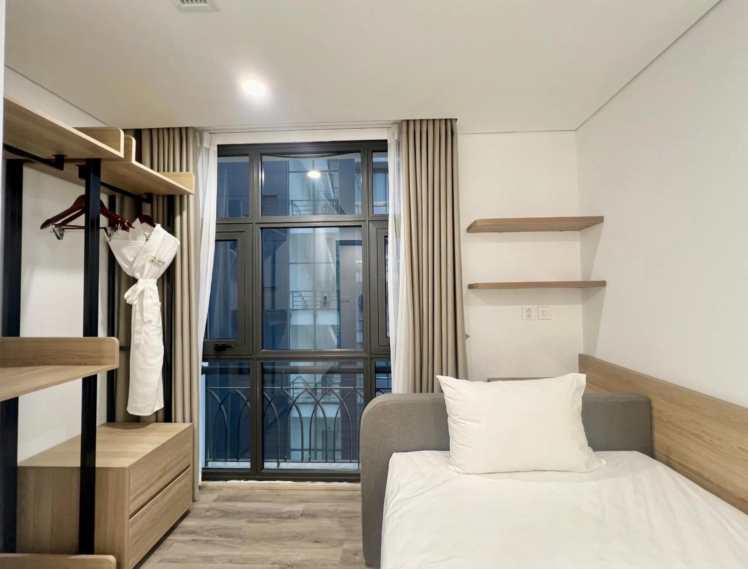 wardrobe, Bed in 22Land Legend Hotel & Residence