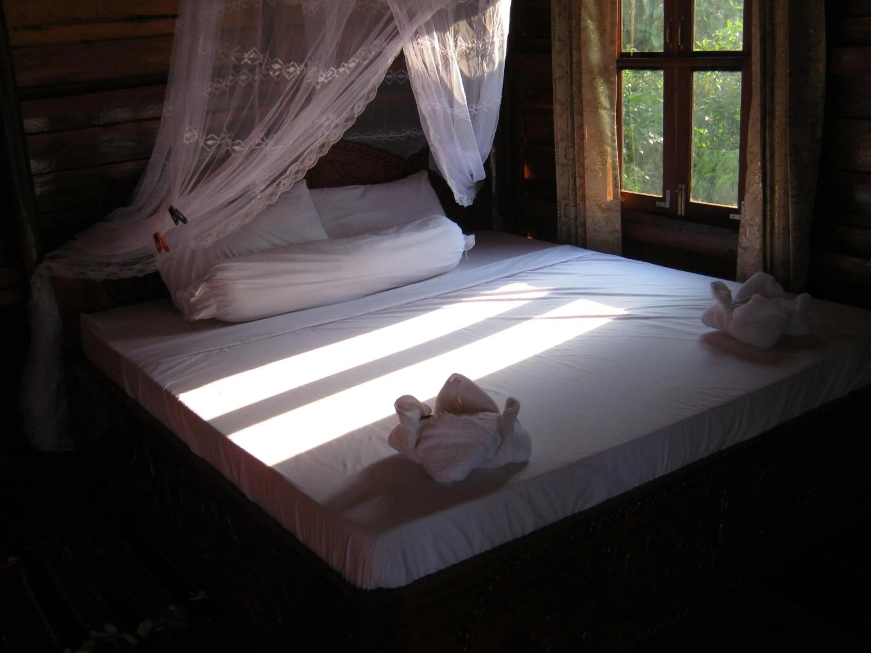 Bed in Coconutbeach Bungalows