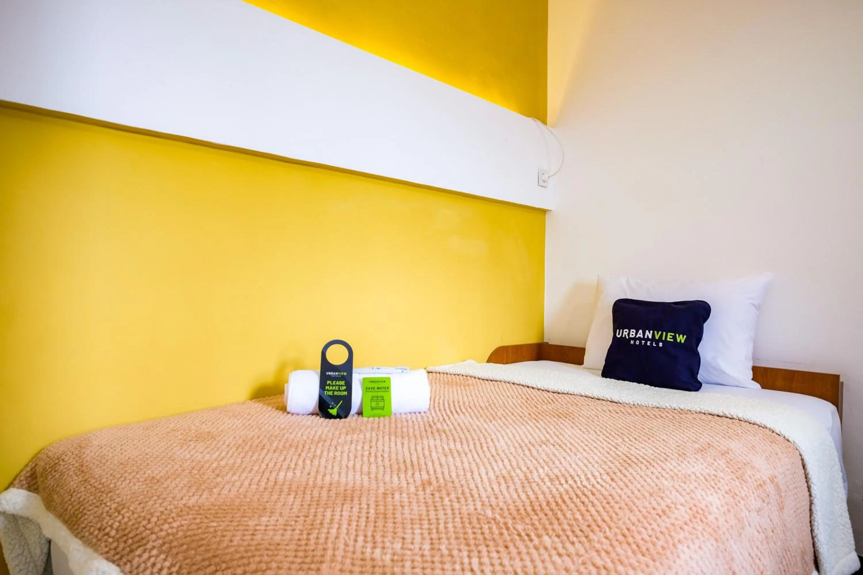 Bed in Urbanview Syariah Soul Sanctuary near Stasiun Purwokerto