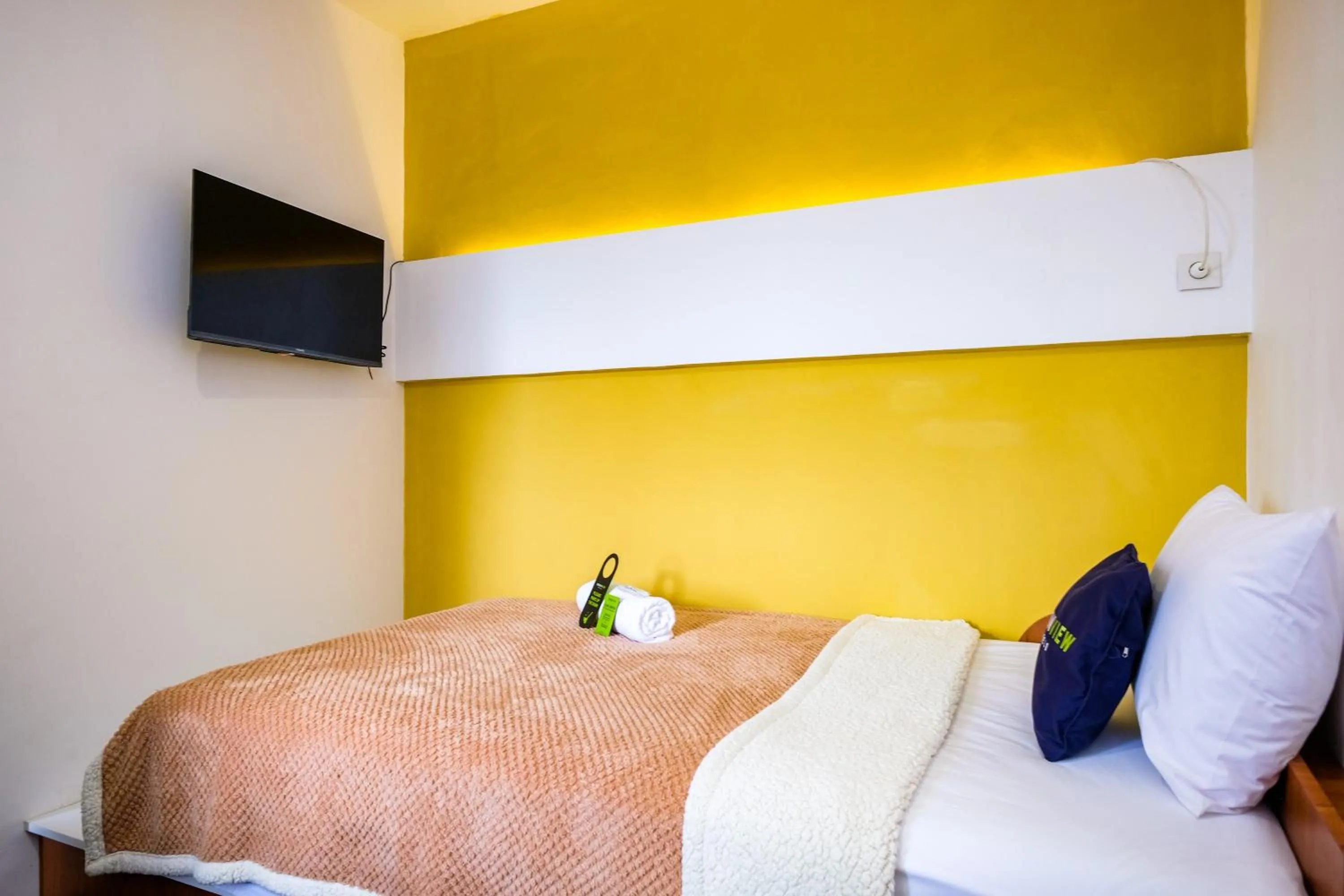 Bed in Urbanview Syariah Soul Sanctuary near Stasiun Purwokerto