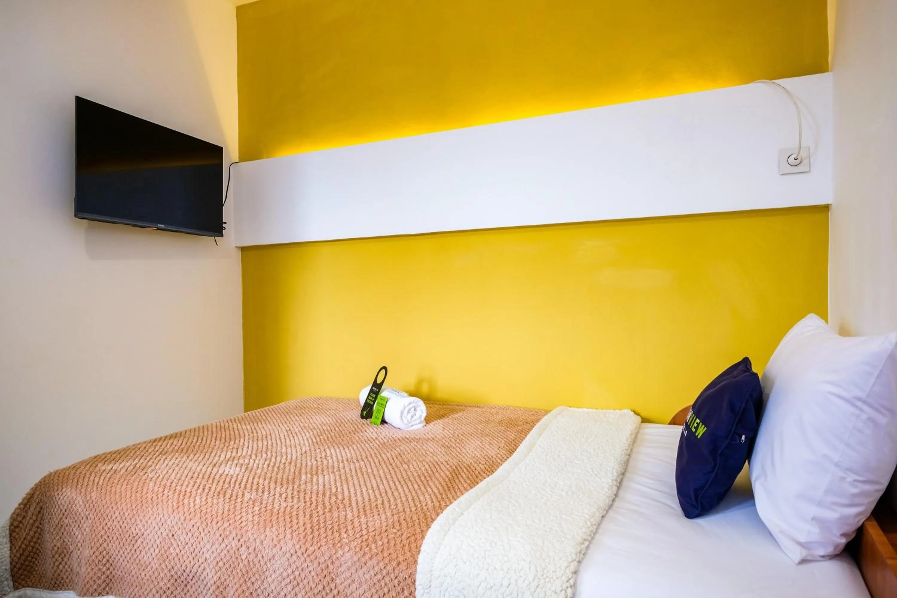 Bed in Urbanview Syariah Soul Sanctuary near Stasiun Purwokerto