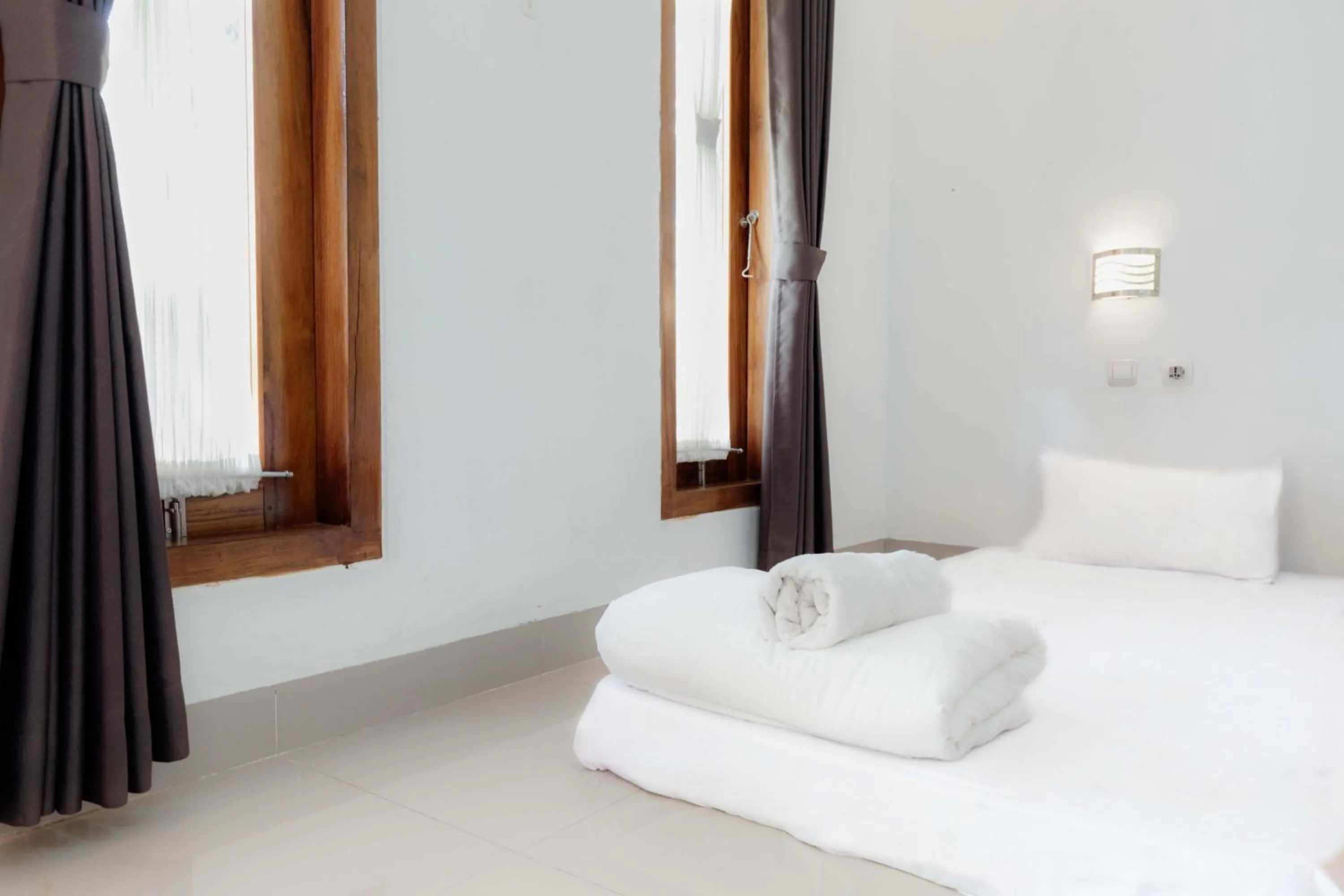 Bed in Coconut Hill Cottage