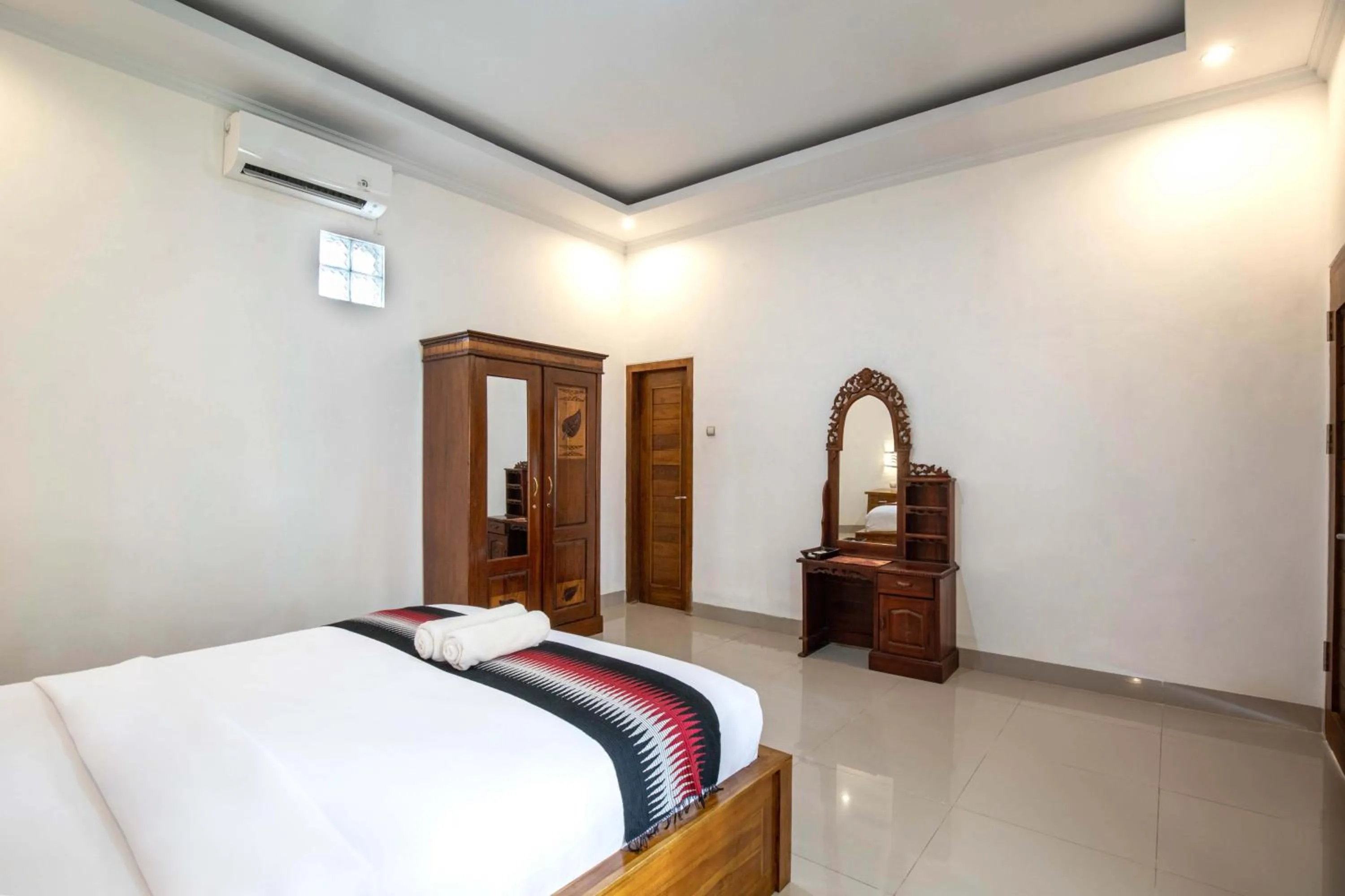 Bed in Coconut Hill Cottage