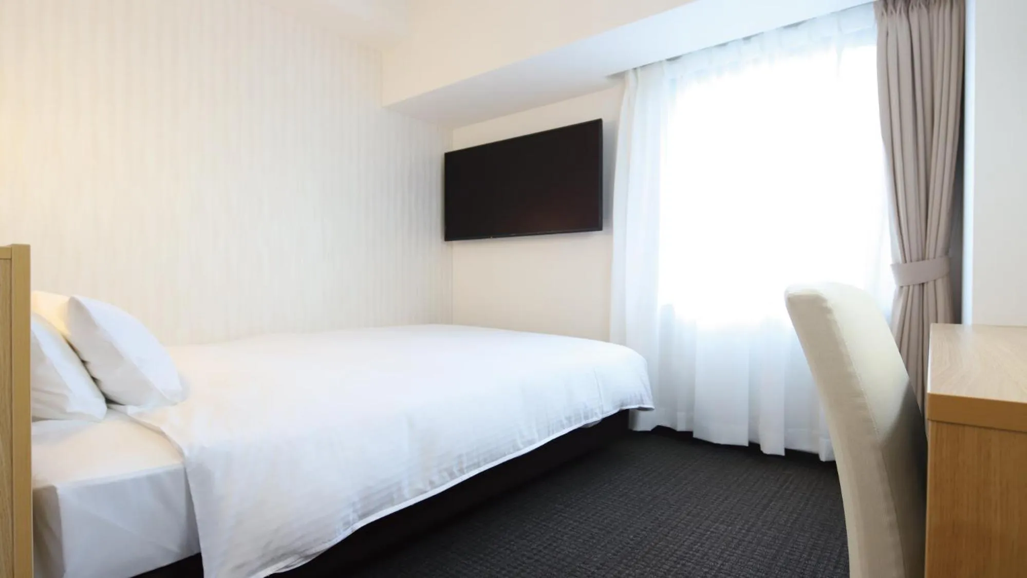 Bed in AB Hotel Kani