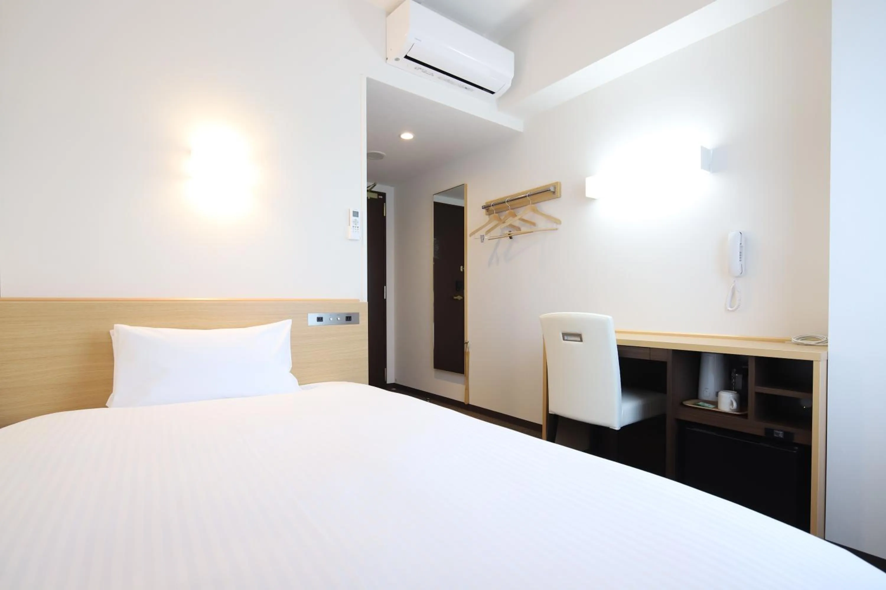 Bed in AB Hotel Kani