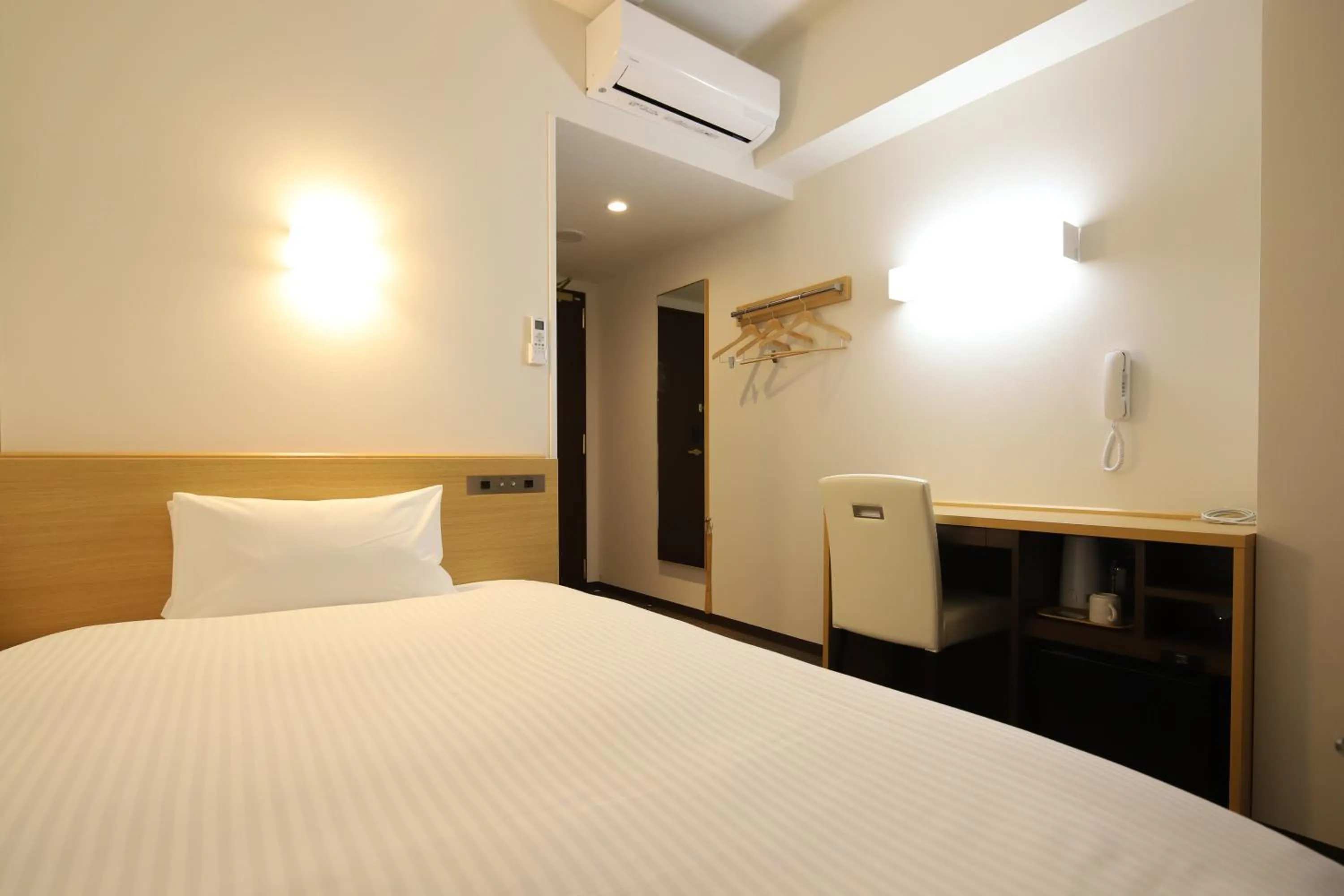 Bed in AB Hotel Kani