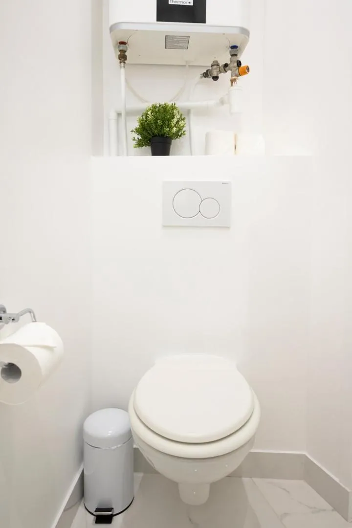 Toilet in Reva Suites
