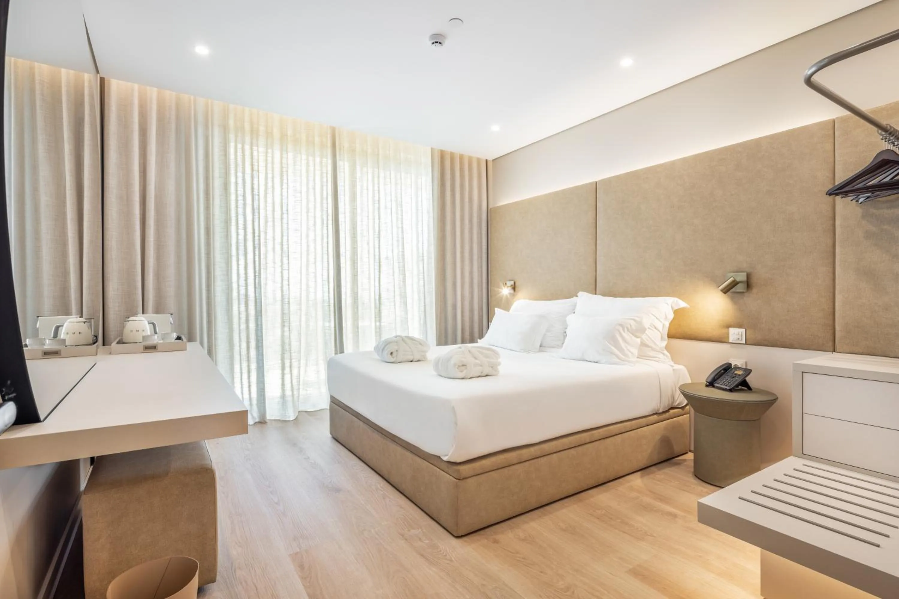 Bed in Castelo Suites Hotel