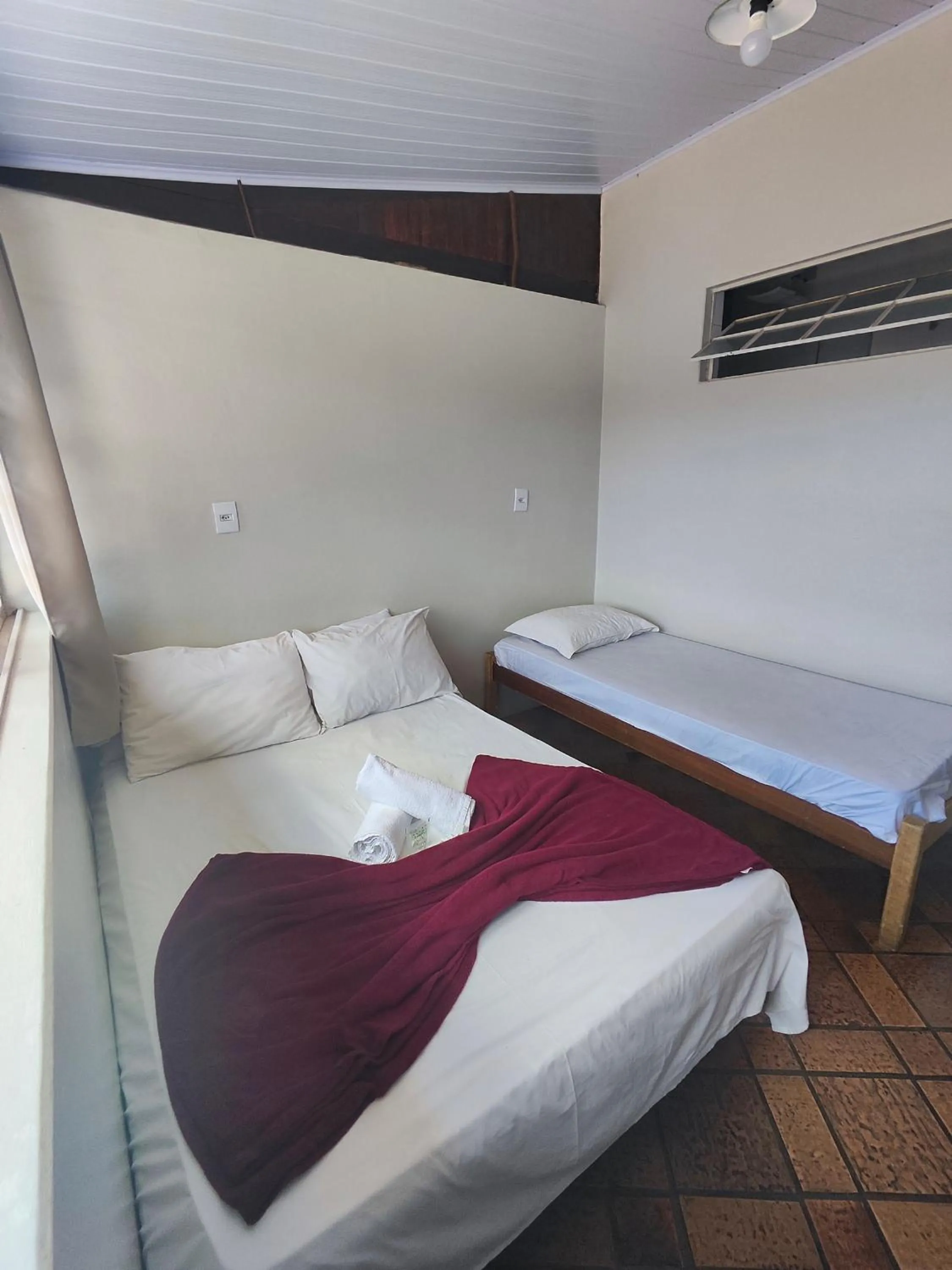 Bed in Pousada Acayaca