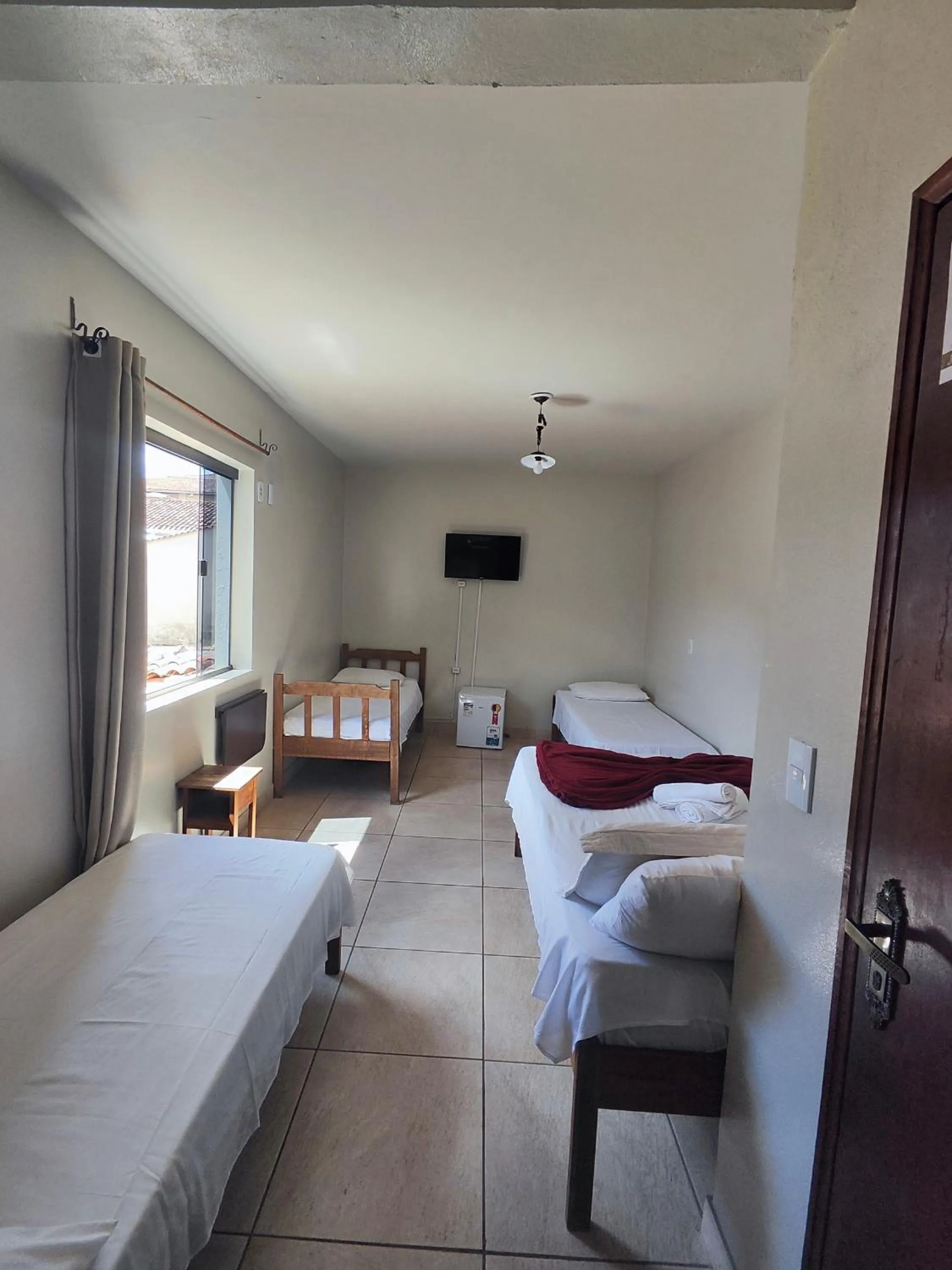 Bed in Pousada Acayaca