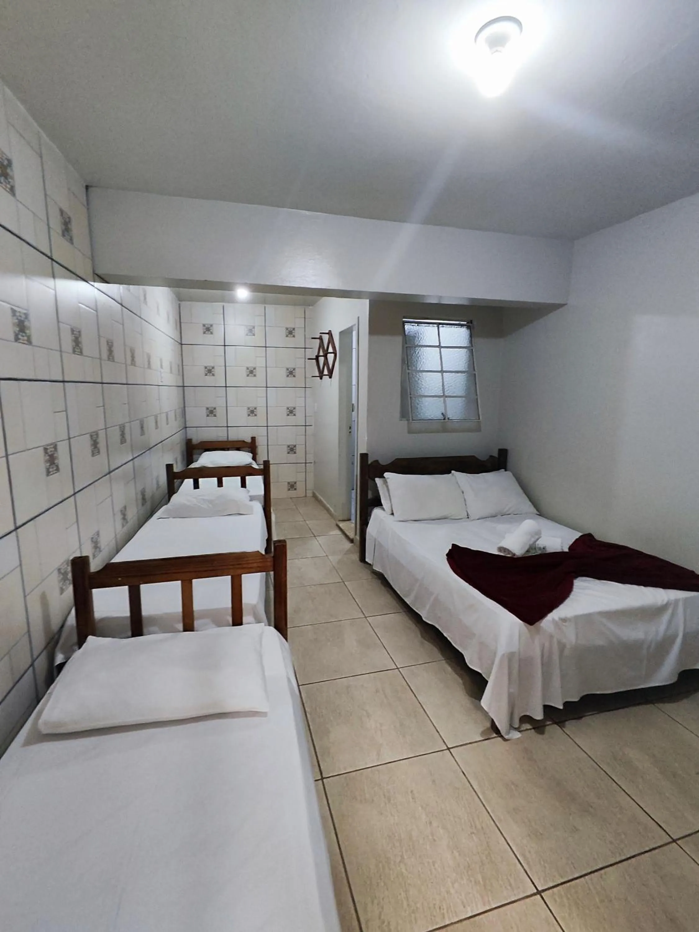 Bed in Pousada Acayaca